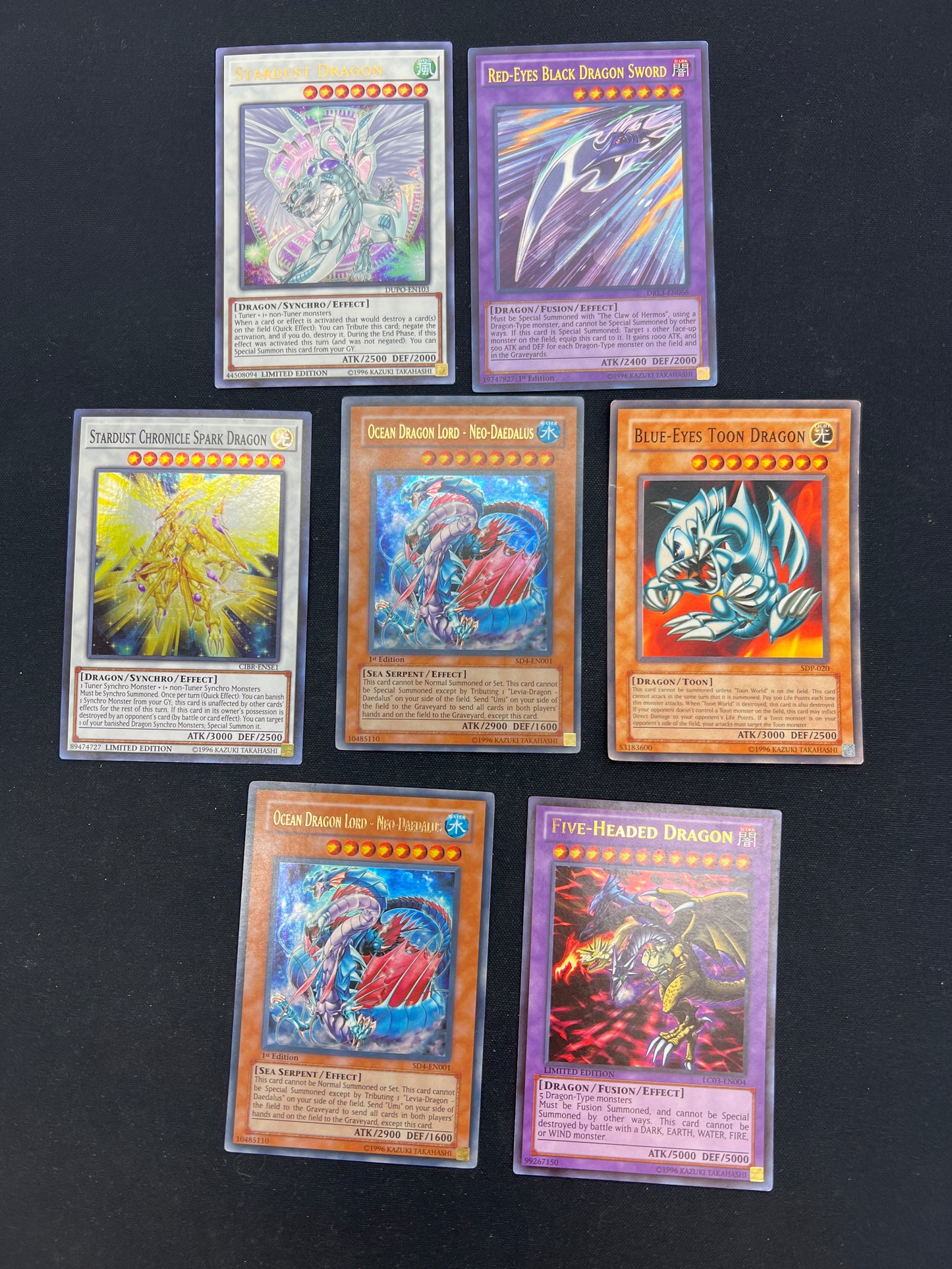 Auction Lot 70: Yu-Gi-Oh Lot of 7 Assorted Holos and Non Holos Conditions Vary