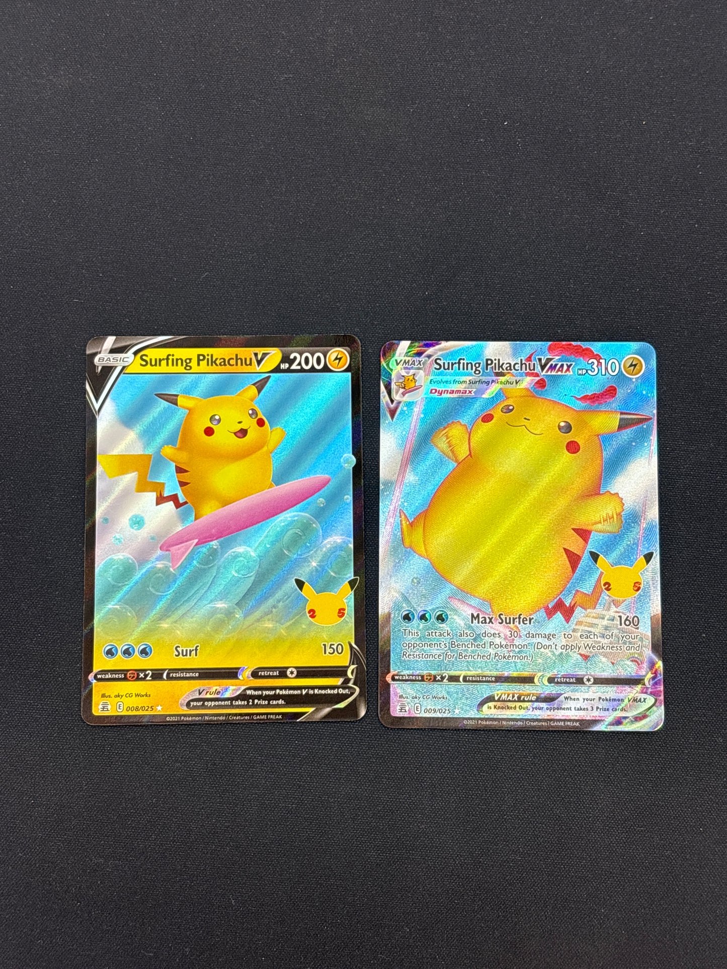Auction Lot 17: Pokemon Celebrations Surfing Pikachu Full Art V and VMAX Card Lot Conditions Vary