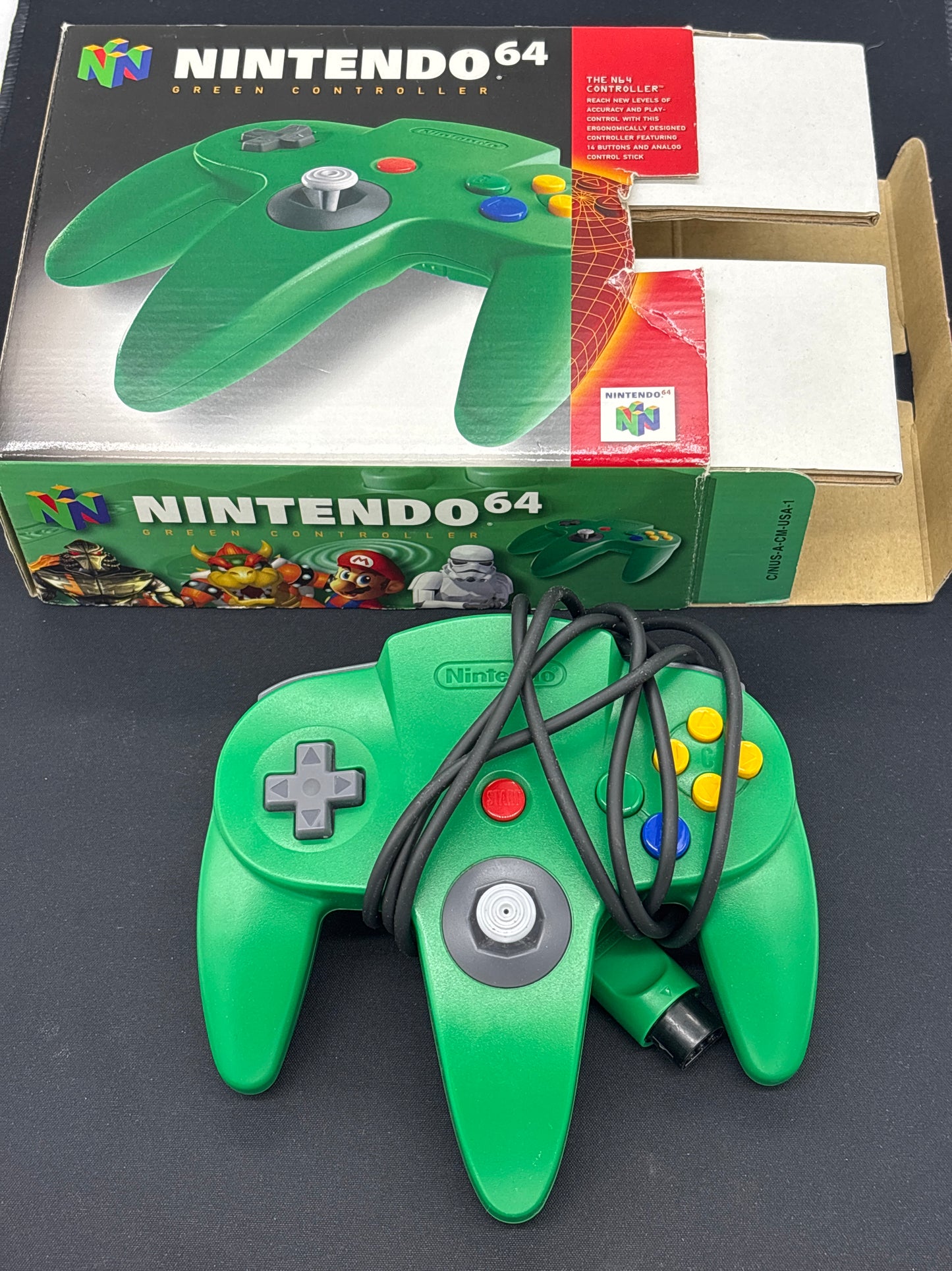 Auction Lot 79: Nintendo N64 Green Controller with Cardboard Insert