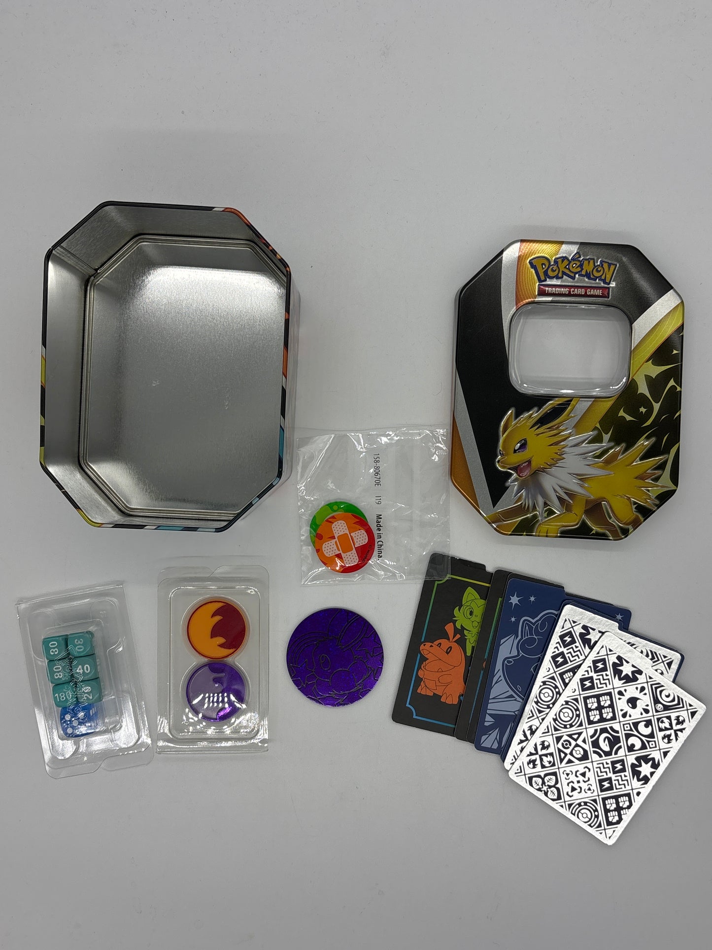 Auction Lot 310: Pokemon Tin With ETB Accessories