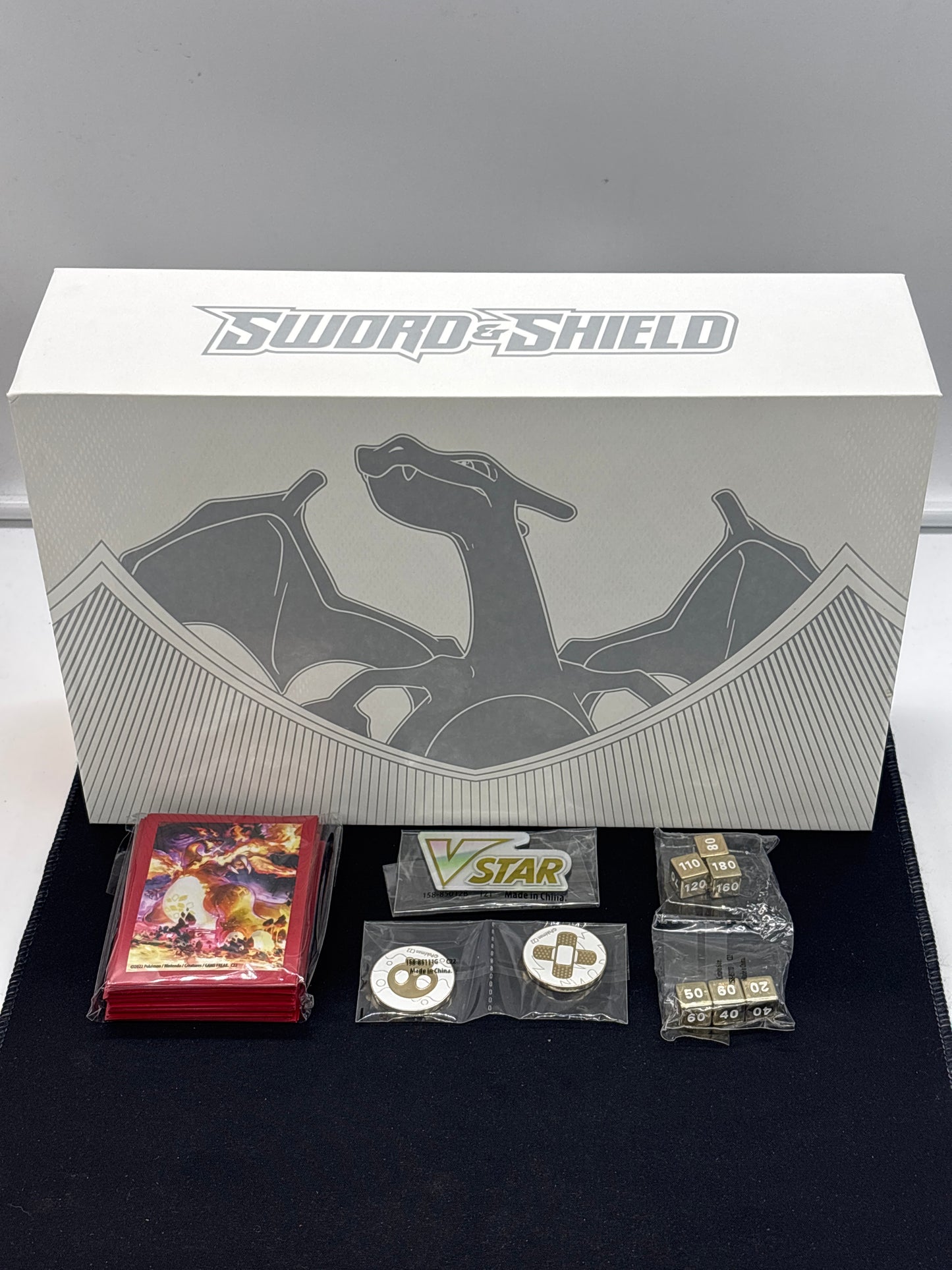 Auction Lot 289: Pokemon SWSH Charizard UPC Collection Empty Box With Contents