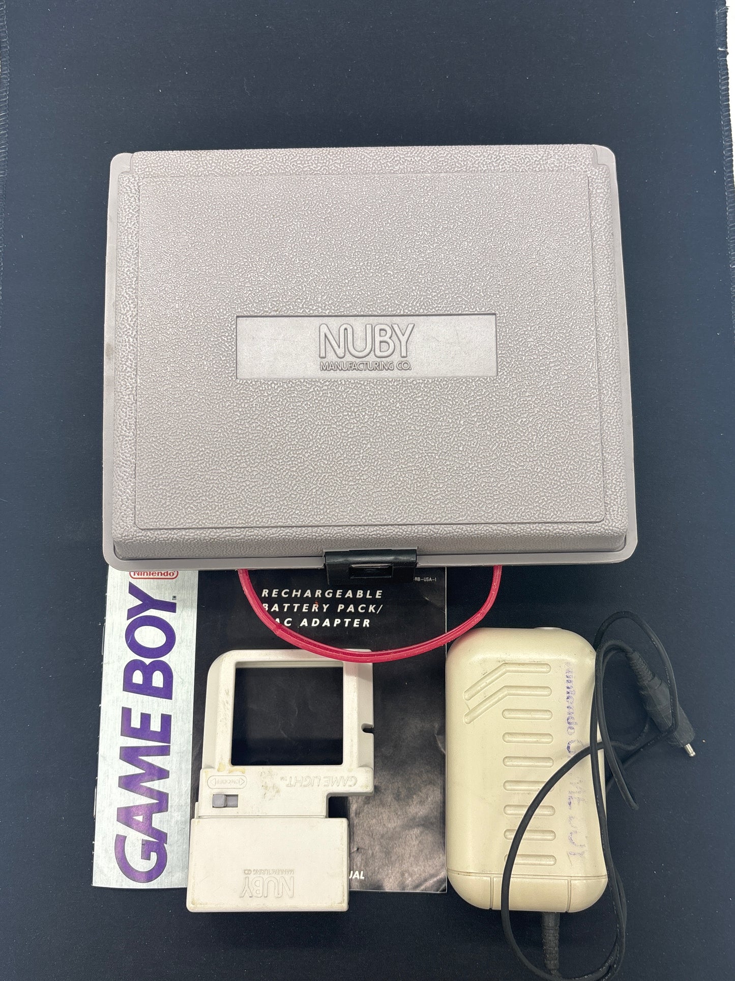 Auction Lot 177: Nintendo Gameboy Light and Rechargeable Battery Accessories with Case