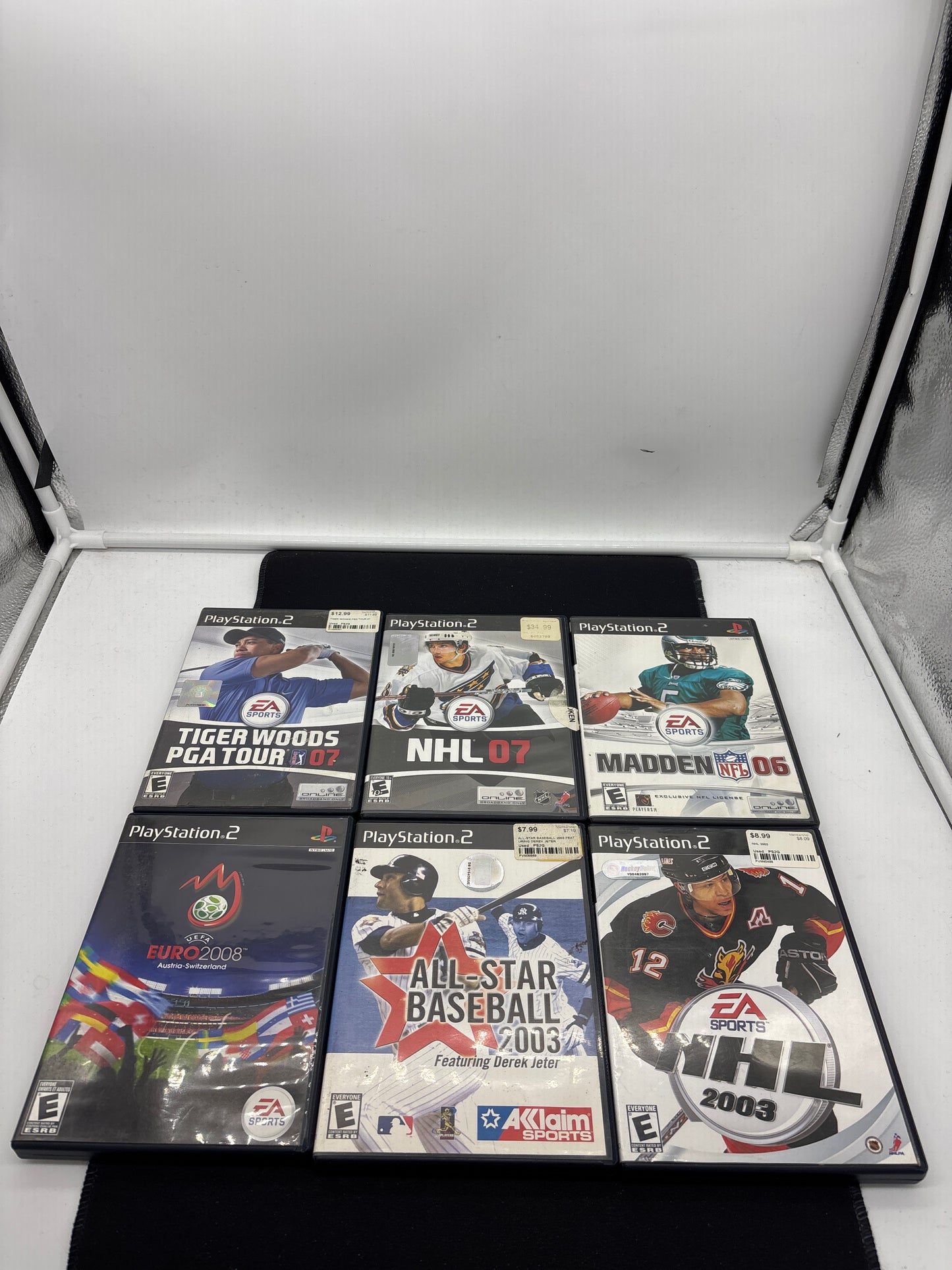 Auction Lot 112: Playstation 2 Video Game Lot of 6 NHL 07 Tiger Woods PGA Tour 07 Madden 06 Euro 2008 NHL 2003 All Star Baseball 2003