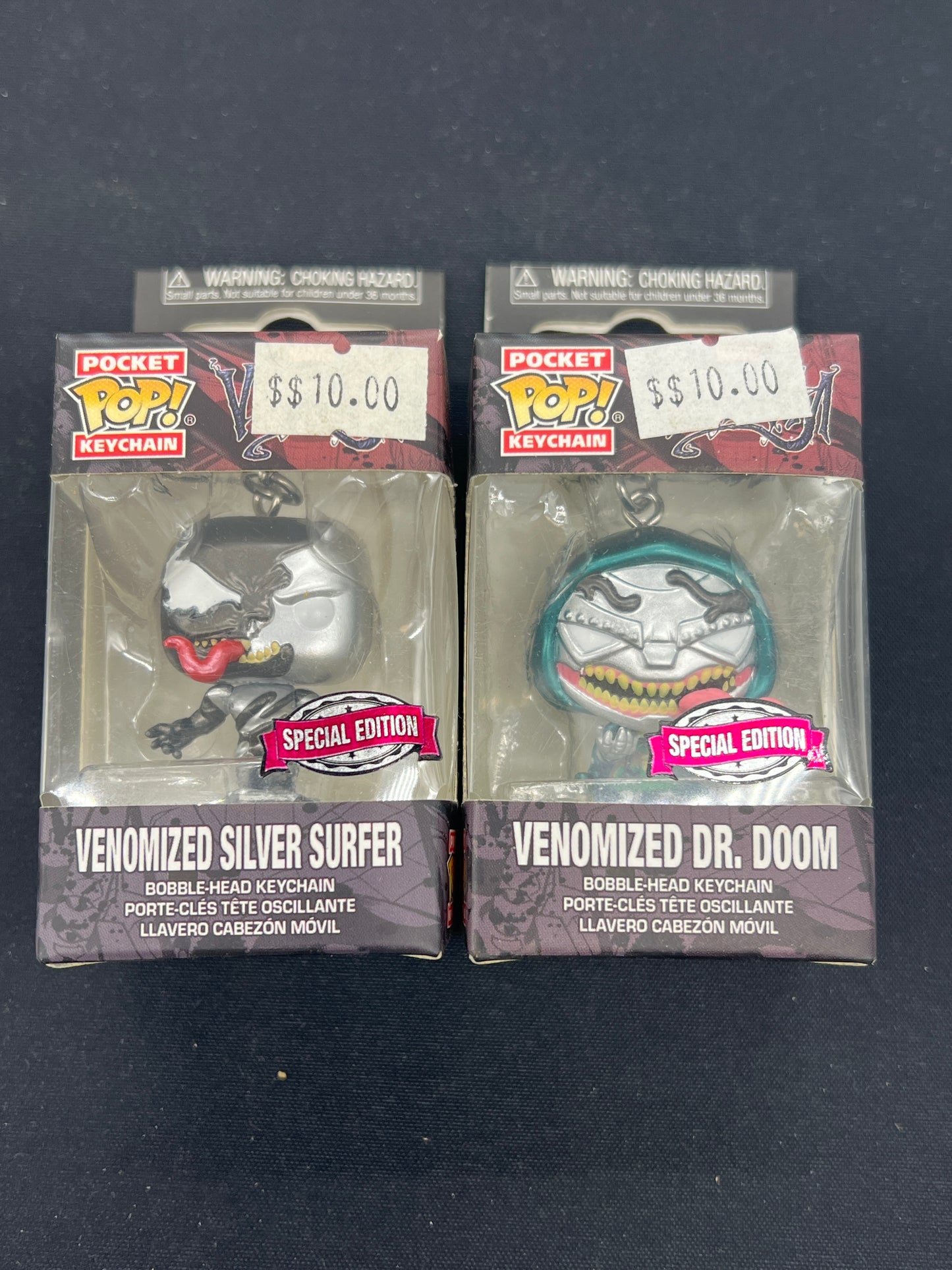 Auction Lot 167: Funko POP Keychain Venomized Silver Surfer & Venomized Dr. Doom