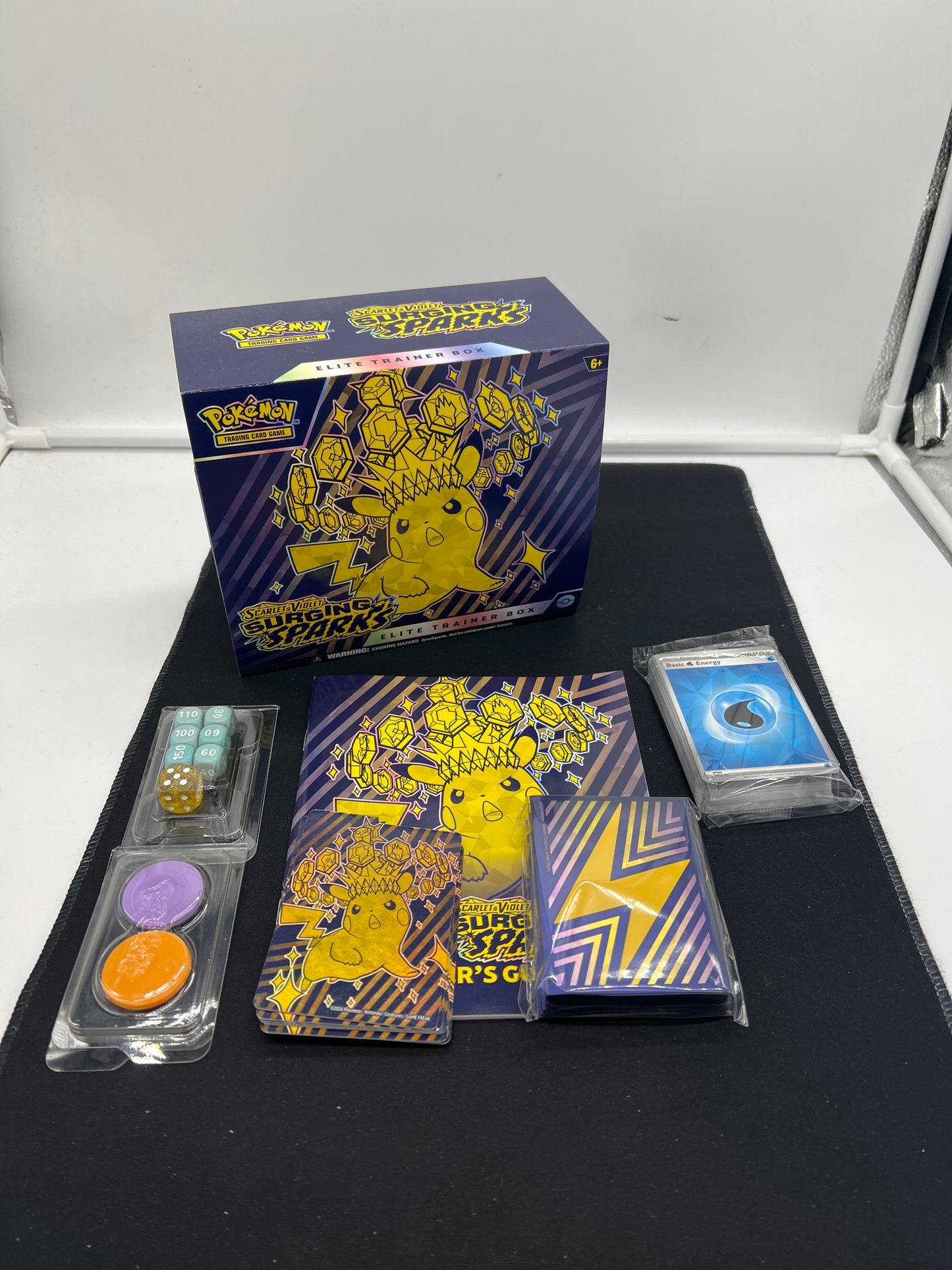 Auction Lot 307: Pokemon Cards Surging Sparks ETB Empty With Accessories