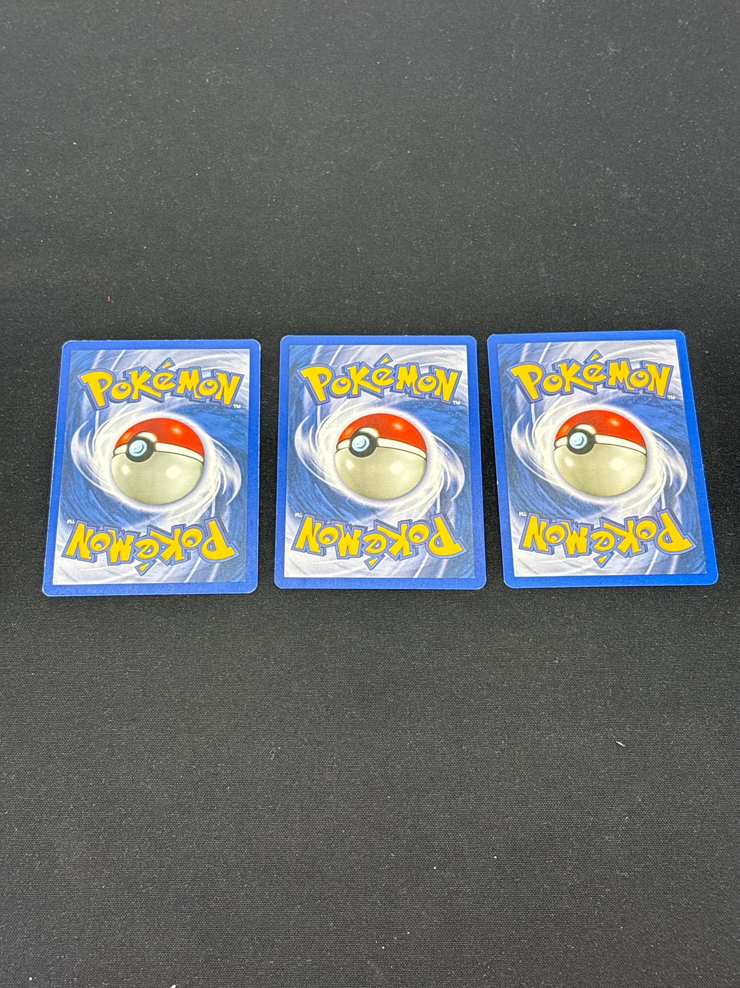 Auction Lot 334: Pokemon Cards Lot of 3 1st Edition Neo Revelation Commons Conditions Vary