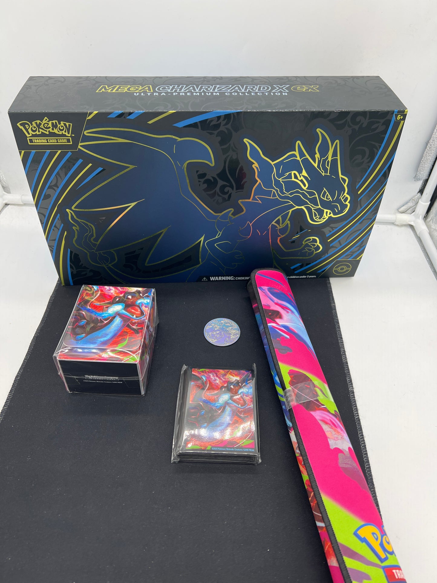 Auction Lot 266: Mega Charizard EX UPC Box & Accessories Lot 1