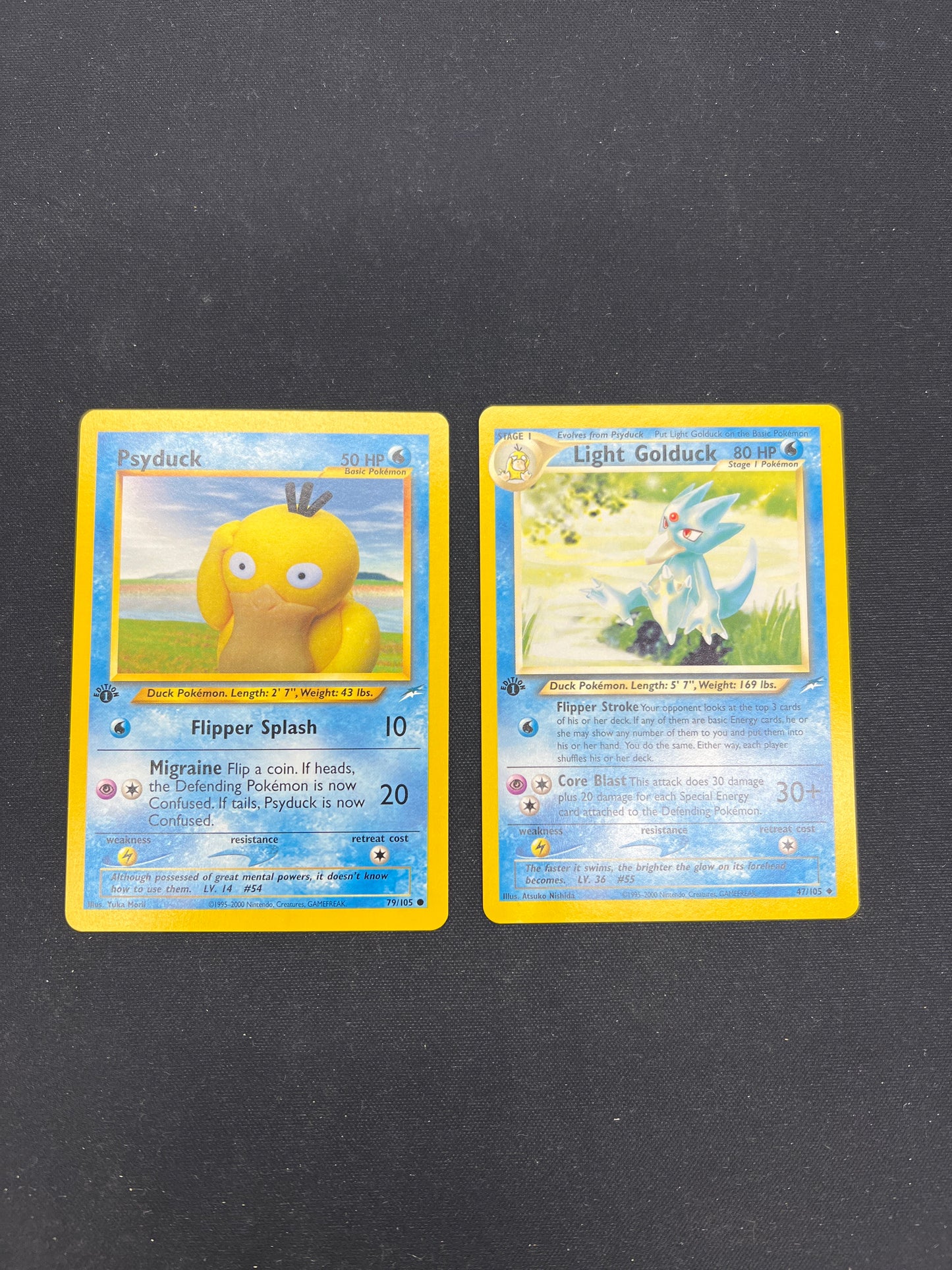 Auction Lot 10: Pokemon Cards Psyduck & Light Golduck 1st Edition Neo Discovery Conditions Vary