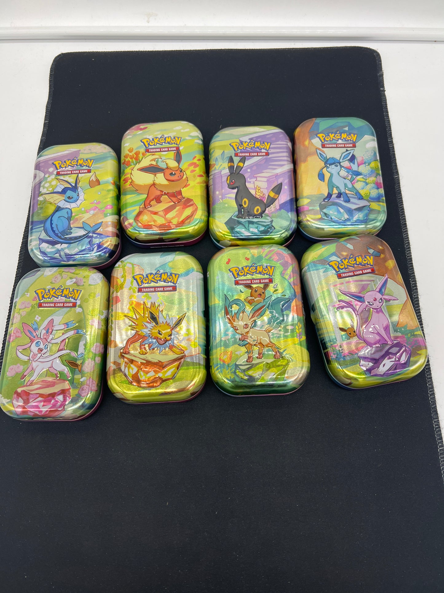 Auction Lot 269: Pokemon Prismatic Evolutions Eeveelution Tins Lot 2