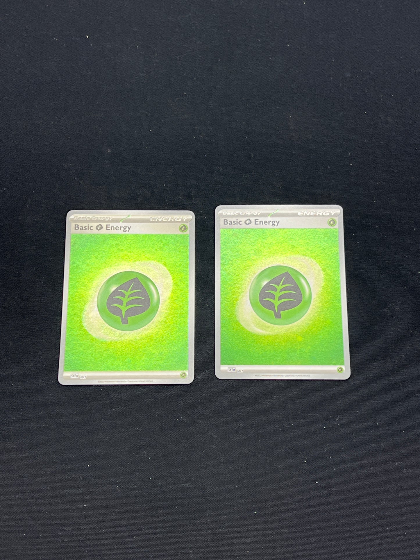Auction Lot 215: Pokemon Cards Lot of 2 Grass Energy Holos 151 Conditions Vary