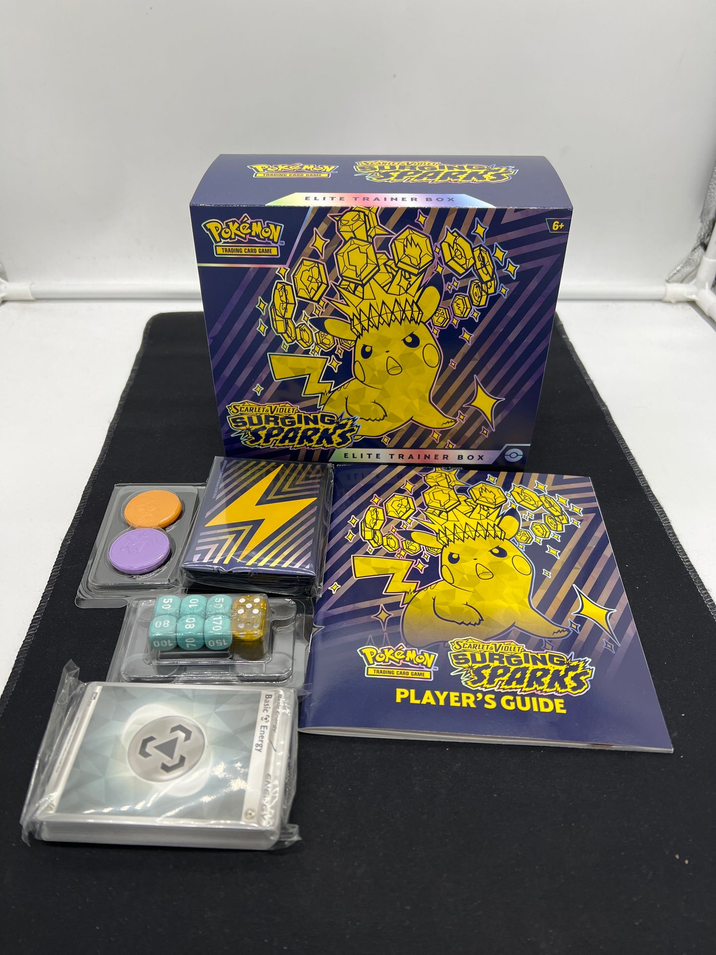 Auction Lot 13: Pokemon Surging Sparks EMPTY ETB With Accessories