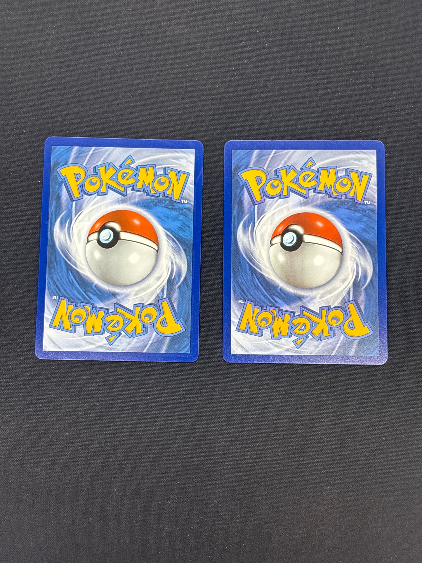 Auction Lot 17: Pokemon Celebrations Surfing Pikachu Full Art V and VMAX Card Lot Conditions Vary