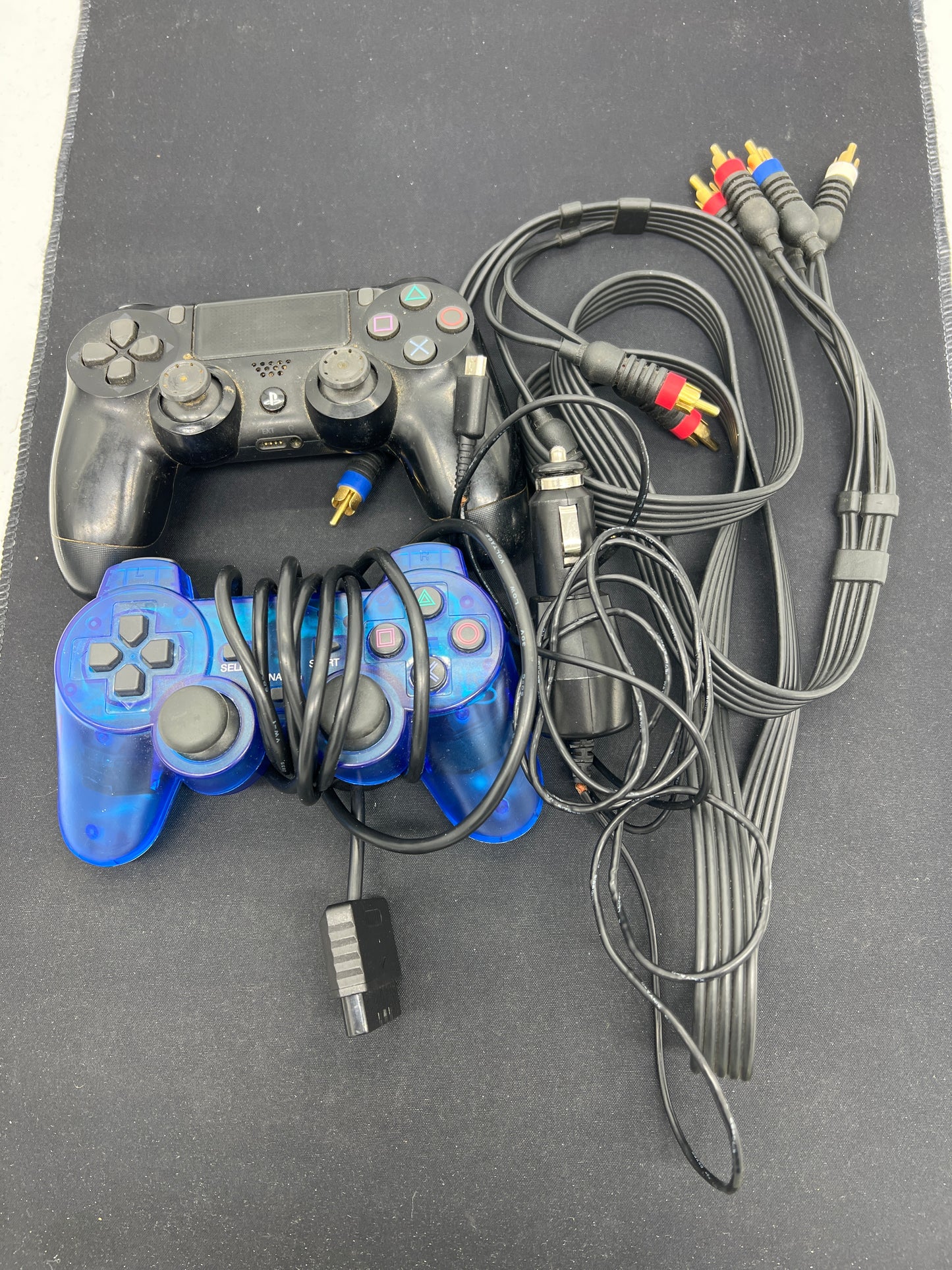 Auction Lot 254: Assorted Lot of Cables and PlayStation Controllers Untested