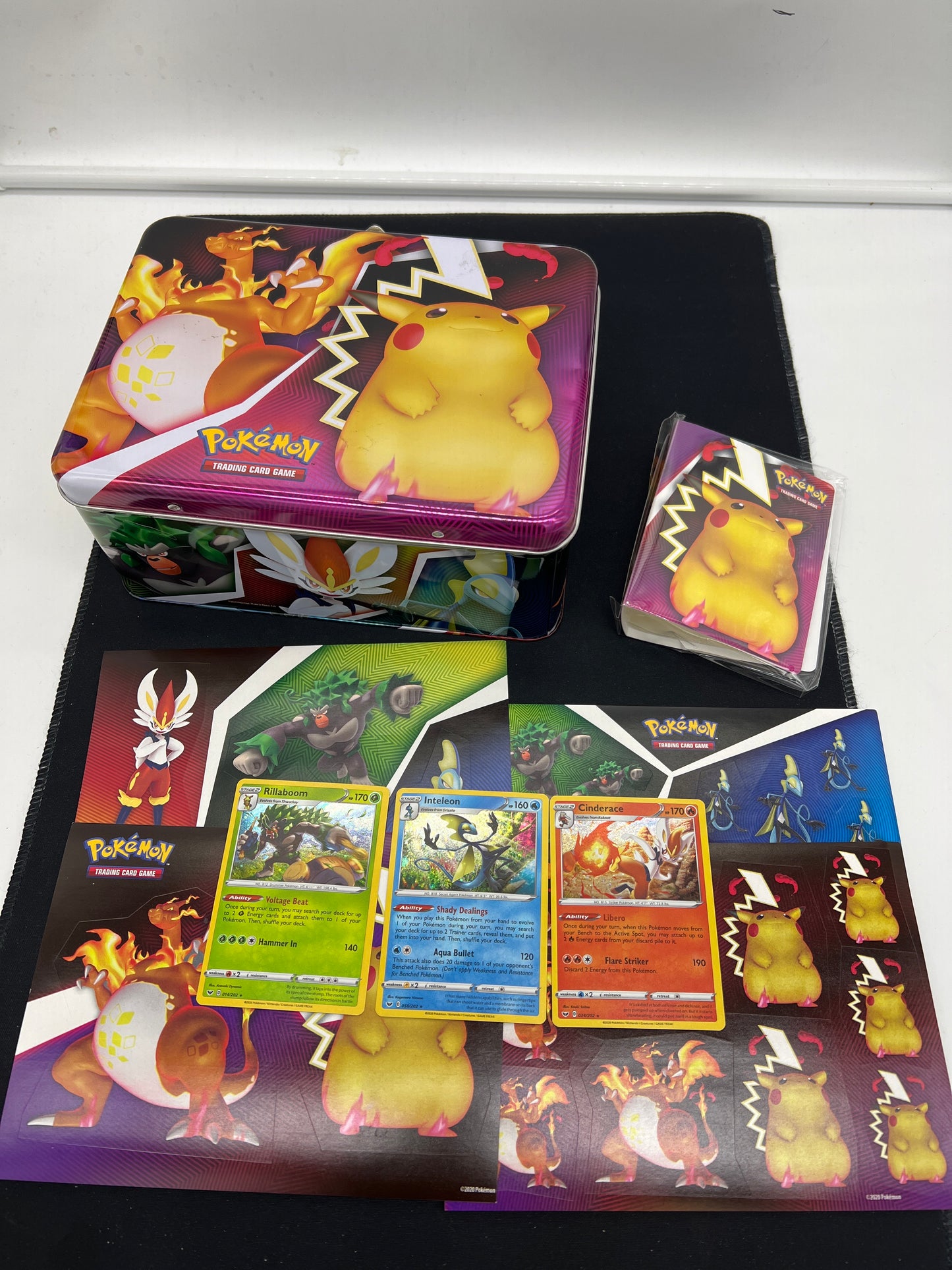 Auction Lot 49: Pokemon Cards SWSH Lunch Tin With Promos and Accessories Conditions Vary