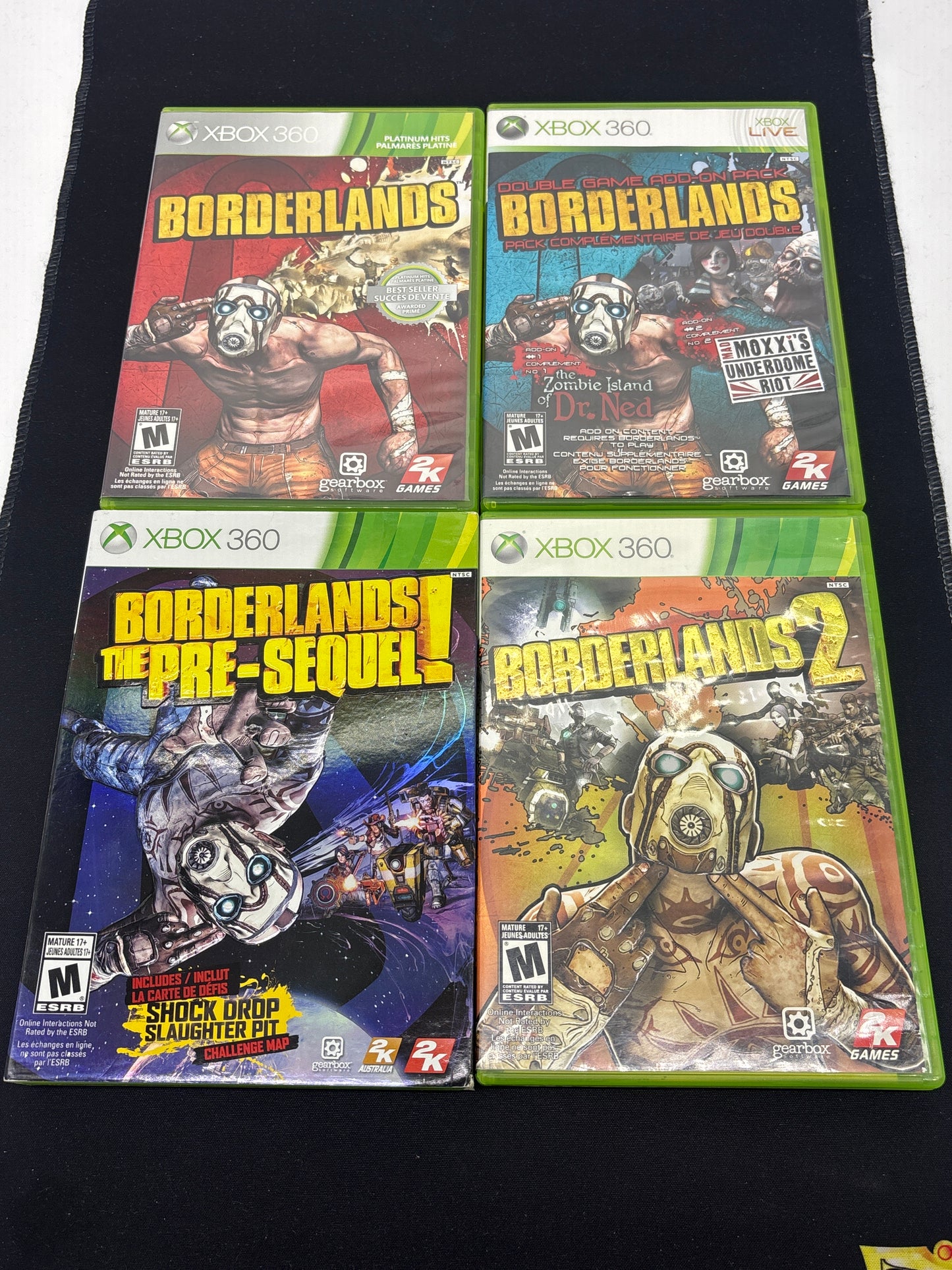 Auction Lot 210: XBOX 360 Video Game Lot of 4 Boderlands Boderlands Double Game Add On Pack Boderlands 2 The Pre-Sequel