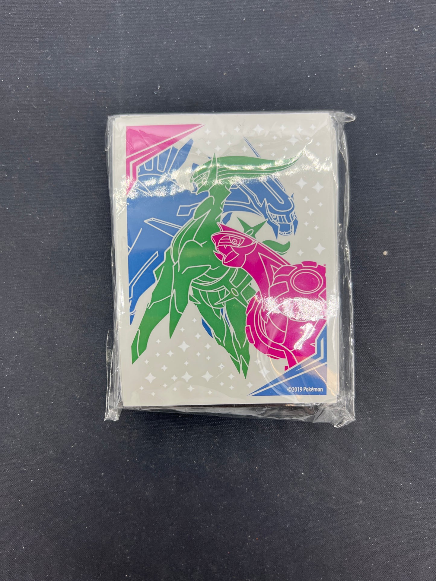 Auction Lot 19: Pokemon Cosmic Eclipse ETB Card Sleeves Unused