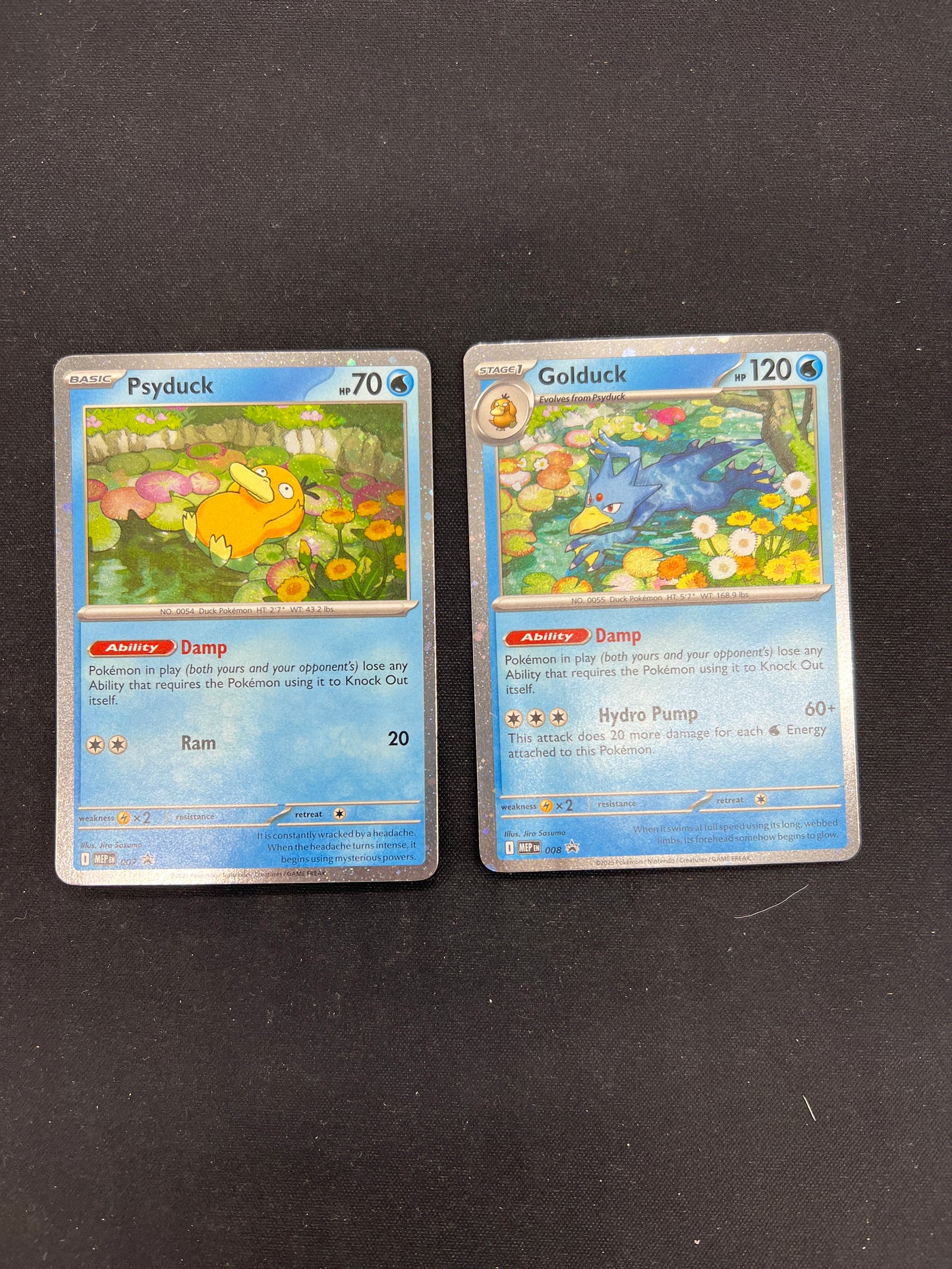 Auction Lot 424: Pokemon Cards Mega Evolutions Cosmo Holo Psyduck and Golduck Promo Conditions Vary