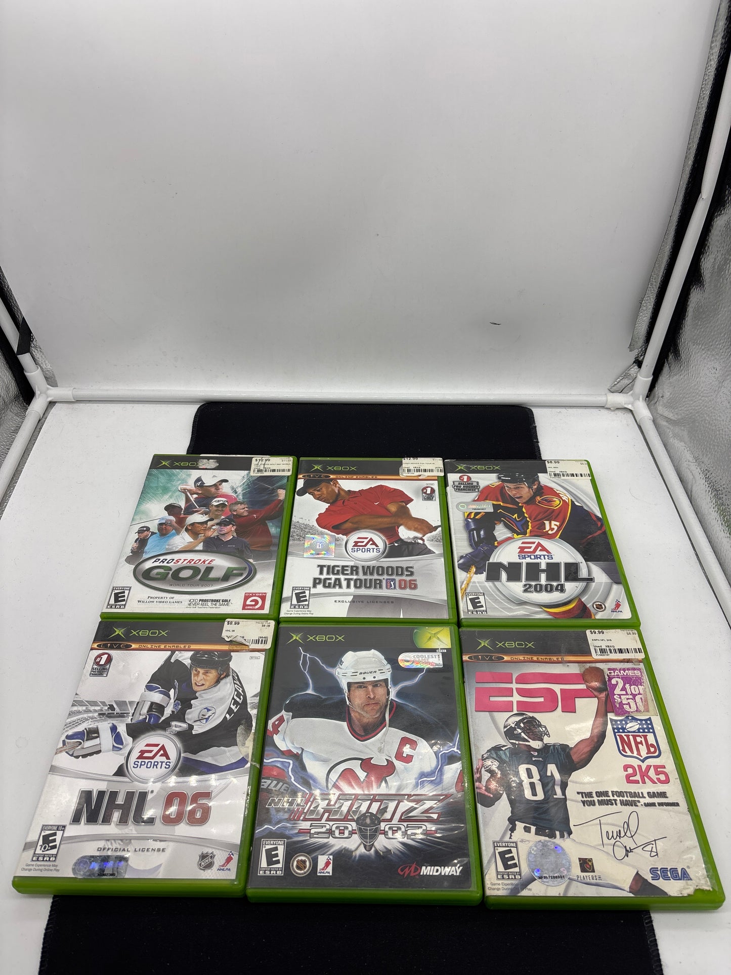 Auction Lot 109: XBOX Video Game Lot of 6 NHL 04 06 ESPN NFL 2K5 Pro Stroke Gold Tiger Wood PGA Tour 06 NHL Hitz 2002