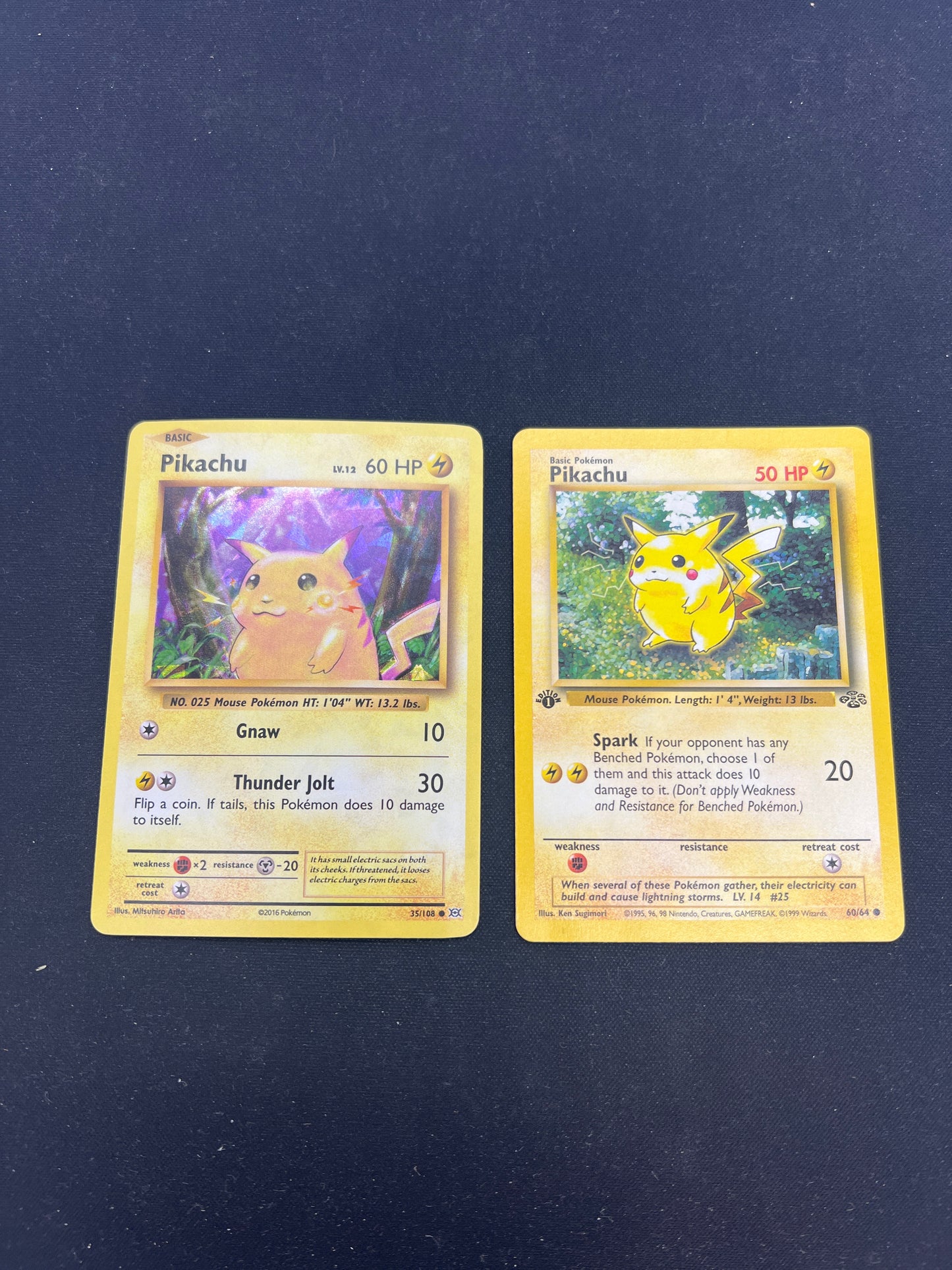 Auction Lot 6: Pokemon Cards Lot of 2 Pikachu Cracked Ice Holo and 1st Edition Jungle Condition Vary