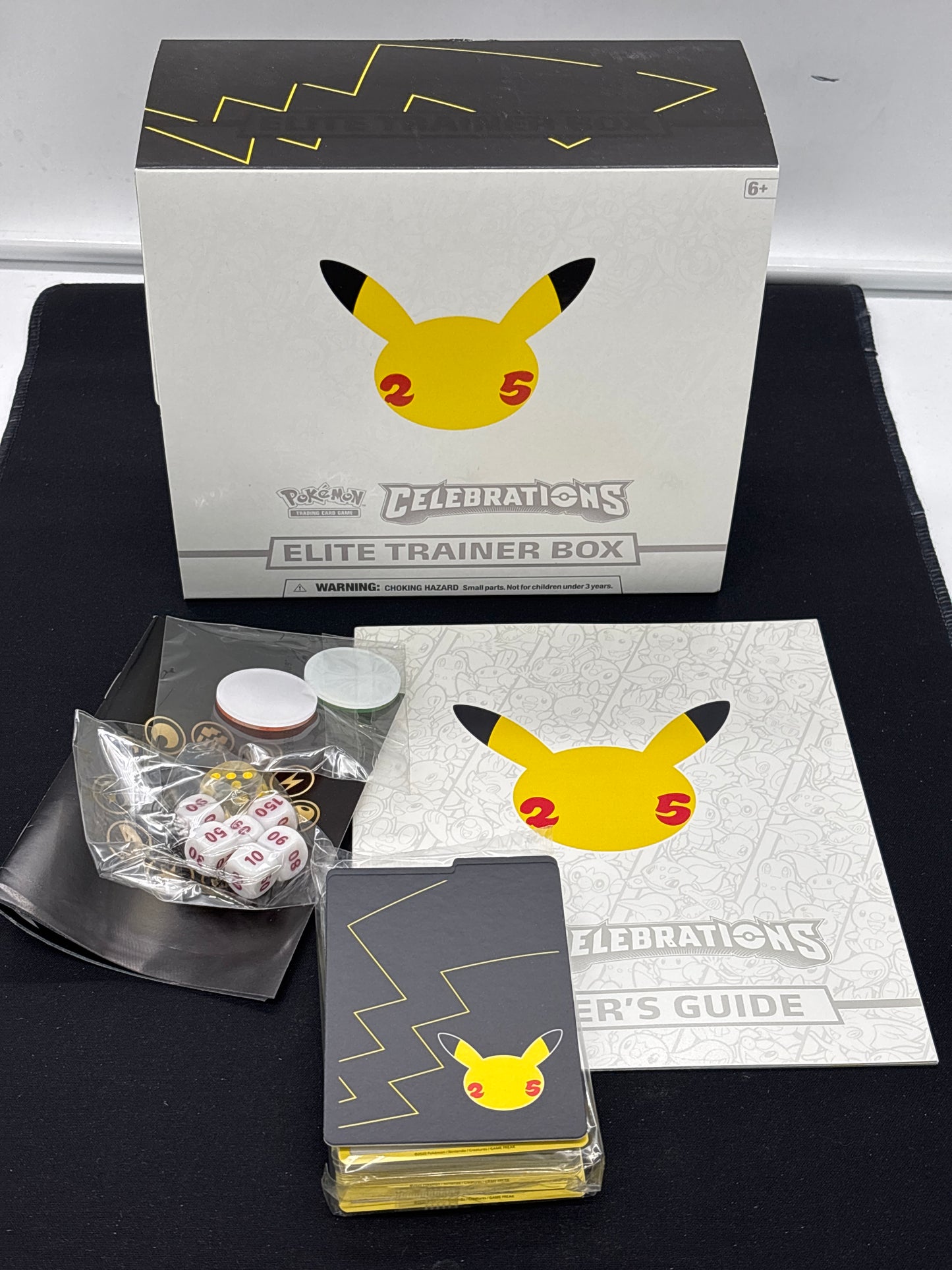 Auction Lot 291: Pokemon Celebration Elite Trainer Box & Accessories