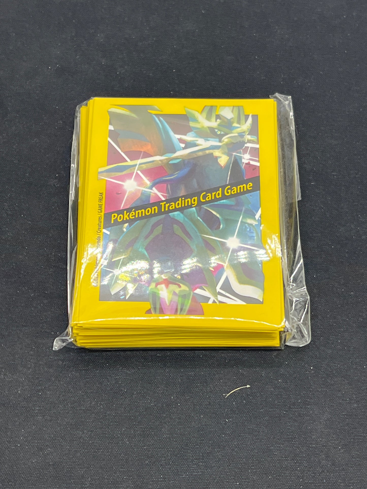 Auction Lot 203: Pokemon ETB Plus Zacian Card Sleeves Unused