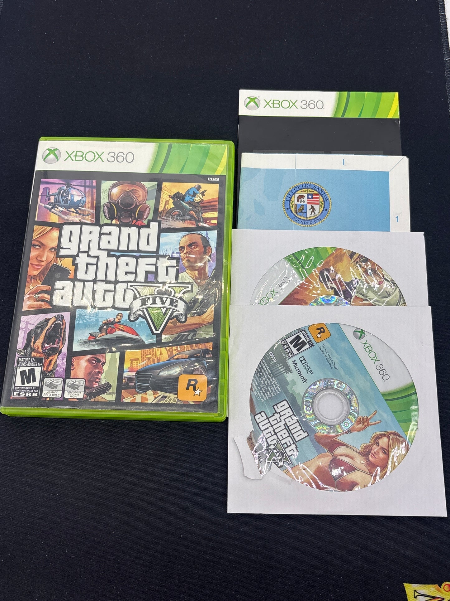 Auction Lot 203: XBOX 360 Video Game Lot of 2 Grand Theft Auto IV Grand Theft Auto V CIB