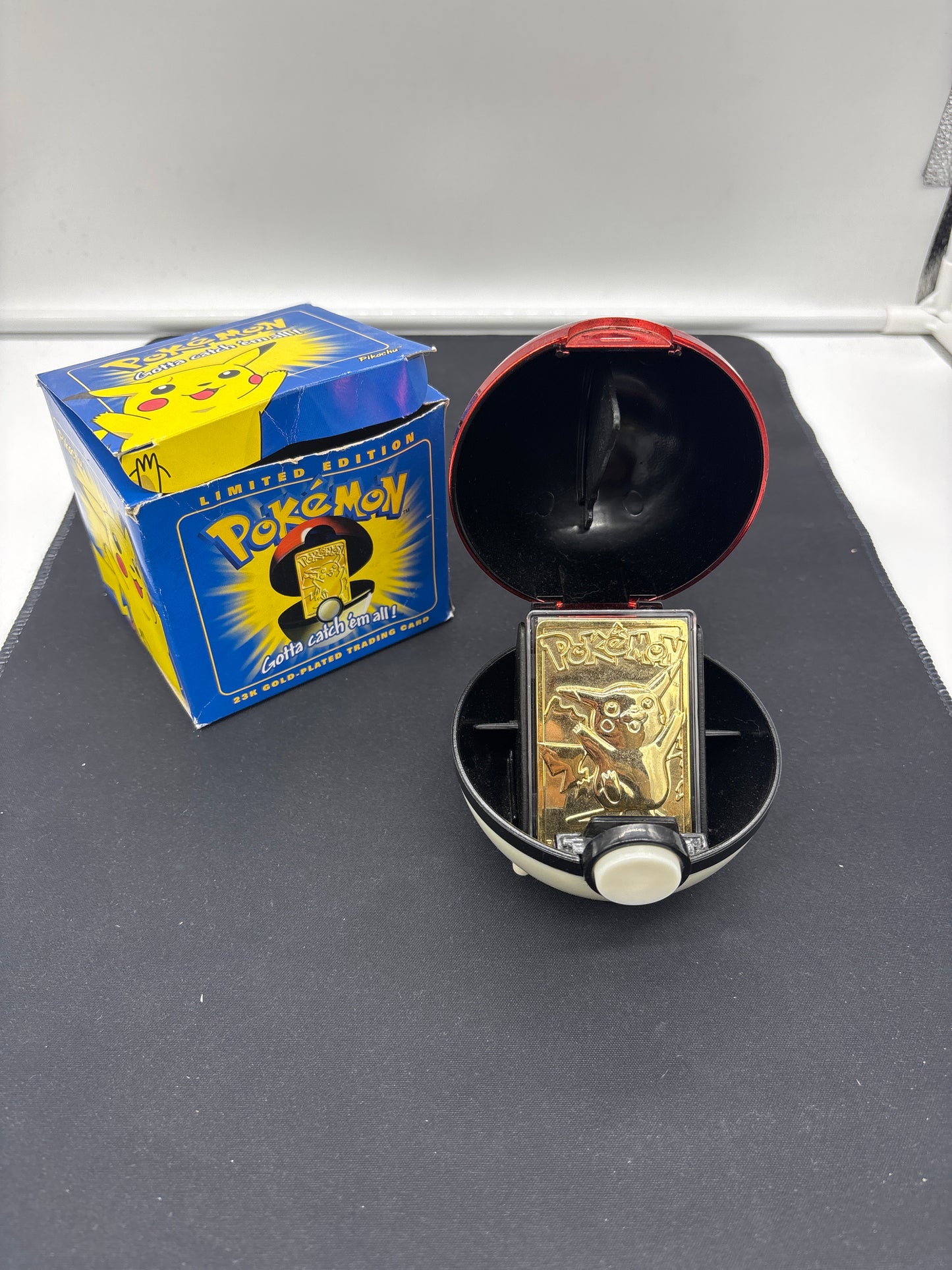 Auction Lot 32: Pokemon 23K Gold Plated Pikachu With Box and Pokeball Holder