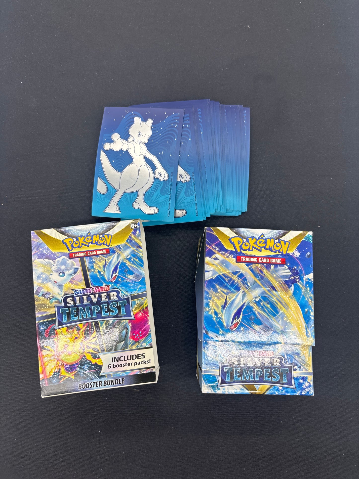 Auction Lot 94: Pokemon Silver Tempest Empty Booster Bundle With 52 Mewtwo Pokemon Go ETB Card Sleeves