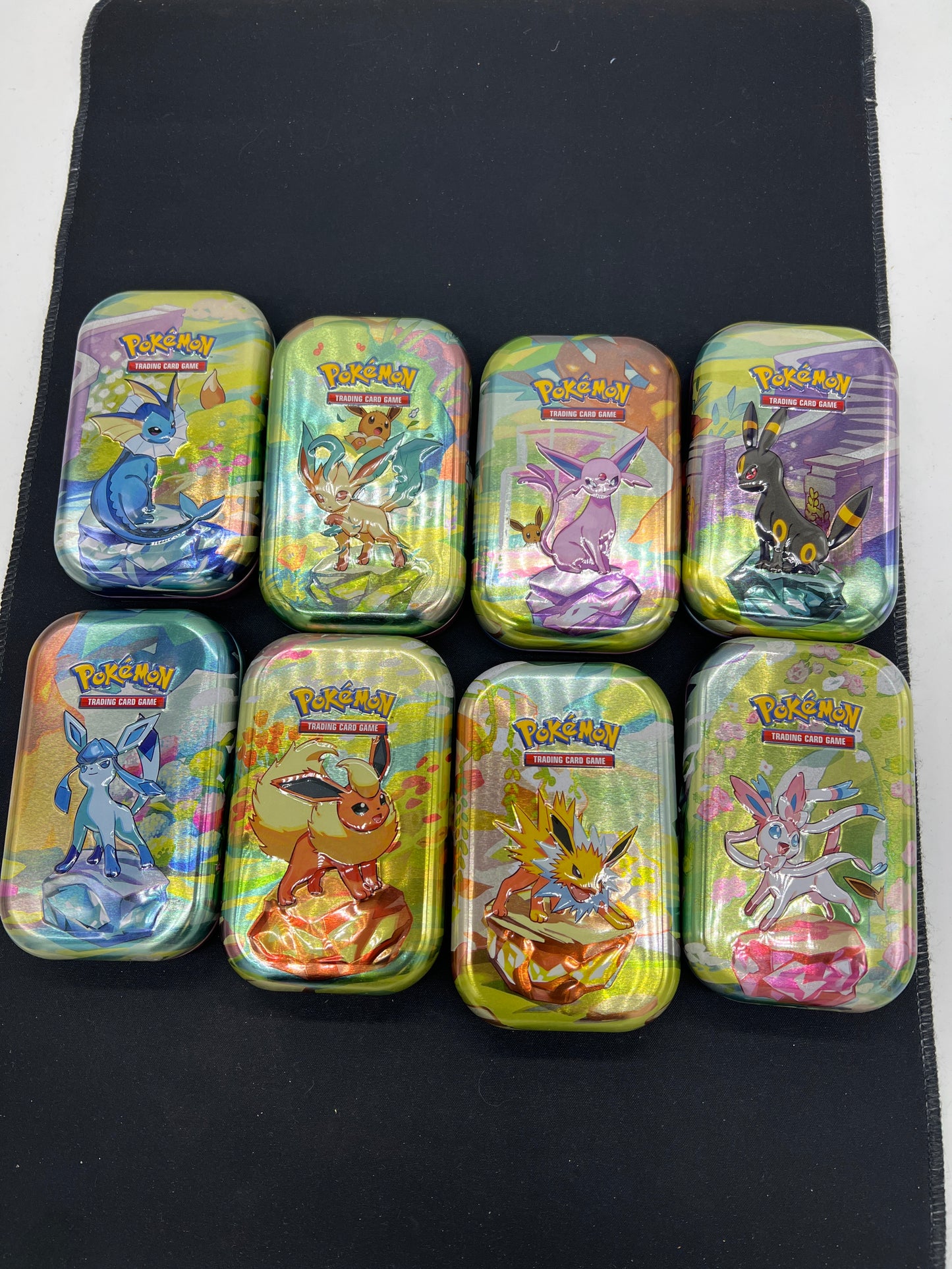 Auction Lot 308: Pokemon Prismatic Evolution Tins Lot 1