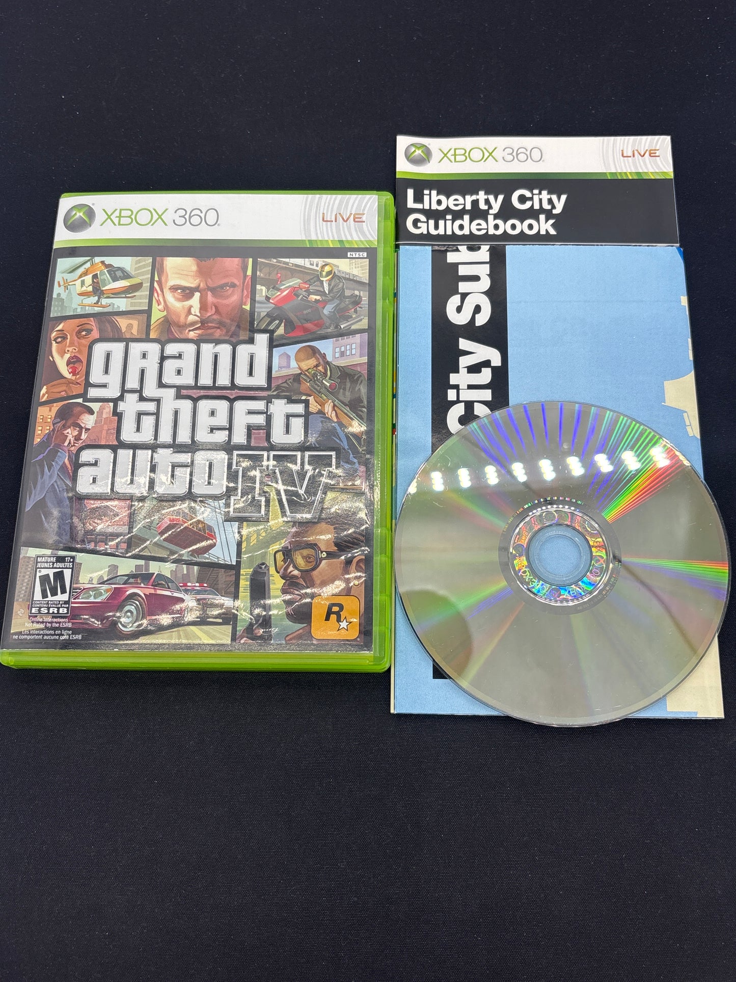 Auction Lot 203: XBOX 360 Video Game Lot of 2 Grand Theft Auto IV Grand Theft Auto V CIB