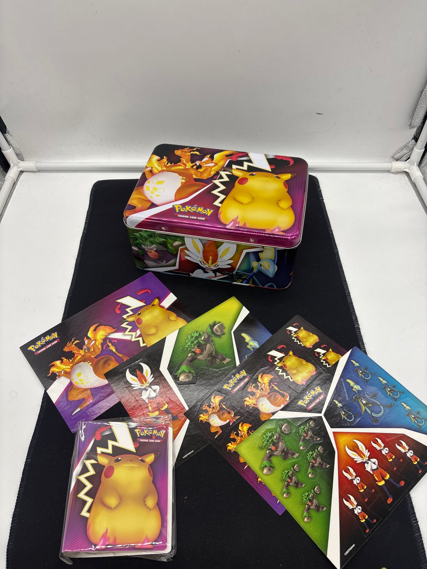 Auction Lot 96: Pokemon EMPTY Tin with Accessories