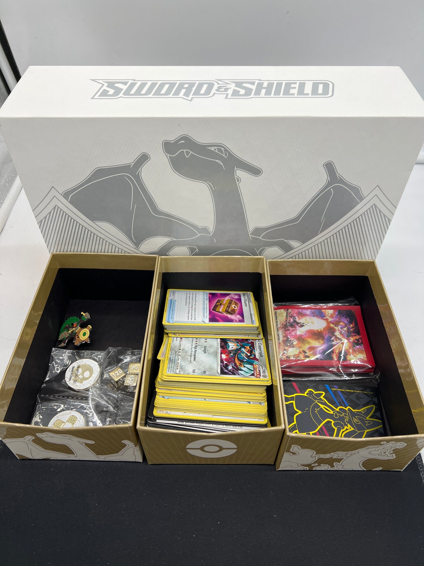 Auction Lot 215: Pokemon SWSH Charizard UPC EMPTY Box With Opened Card Sleeves and Commons Uncommons