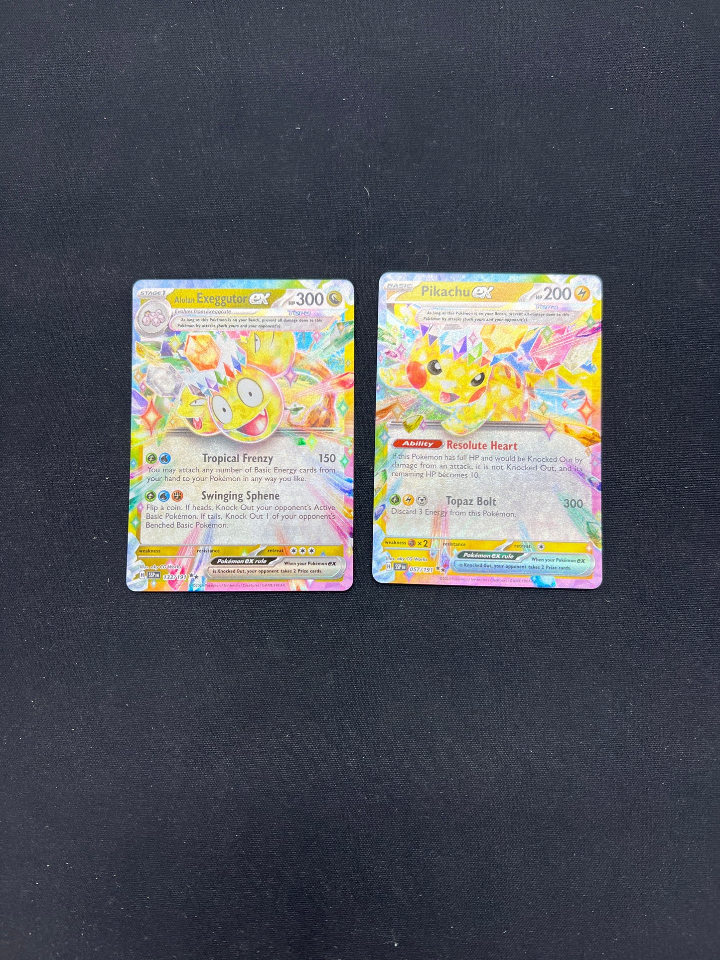 Auction Lot 252: Pokemon Cards Alolan Exeggutor & Pikachu EX Surging Sparks Conditions Vary