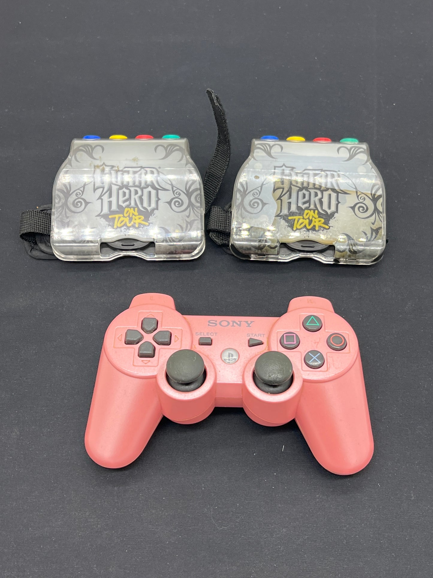 Auction Lot 240: Guitar Hero Accessories and Playstation 3 Pink Controller Lot Untested