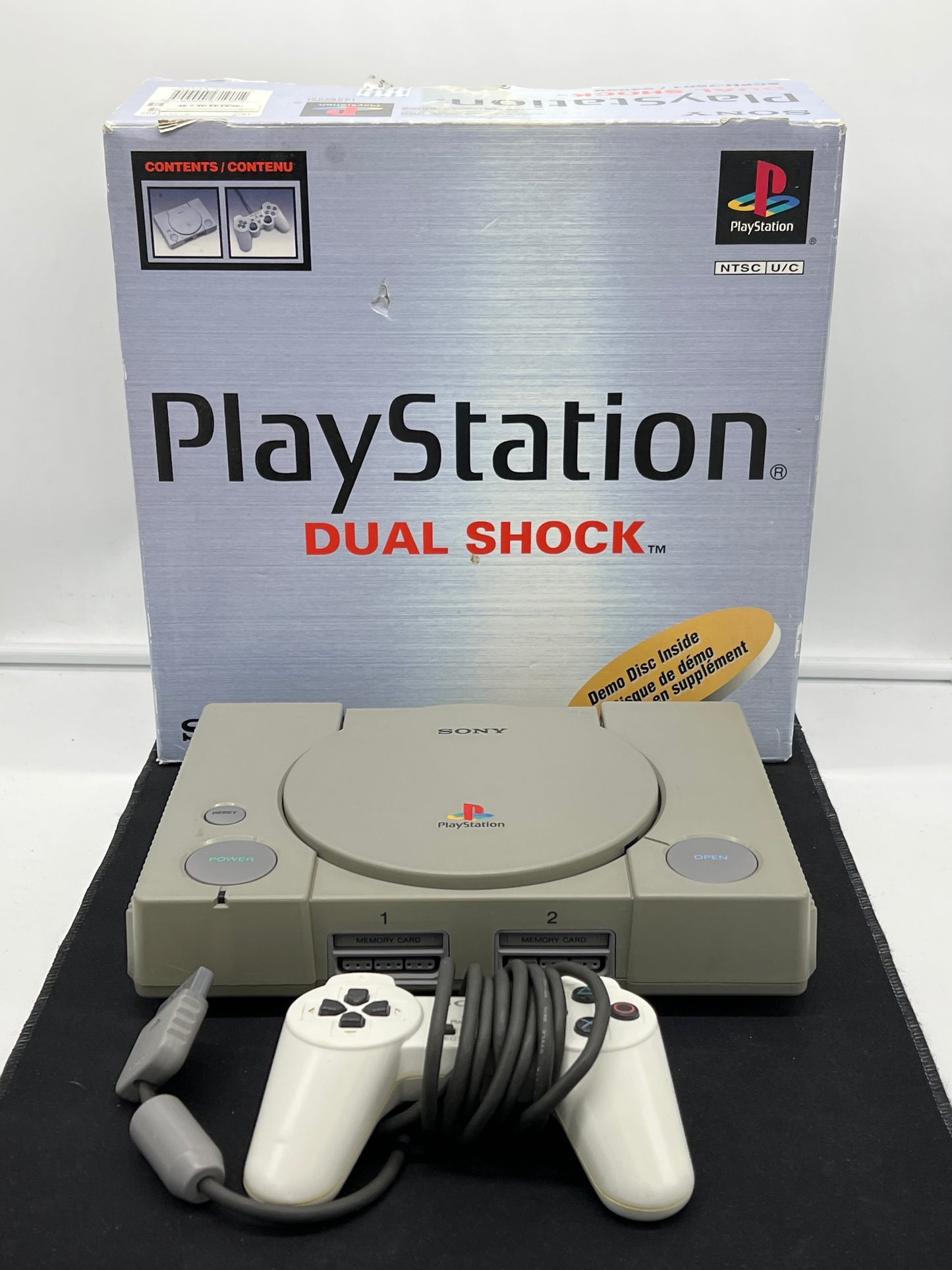 Auction Lot 4: PlayStation 1 Dual Shock Console With Cords and Controller