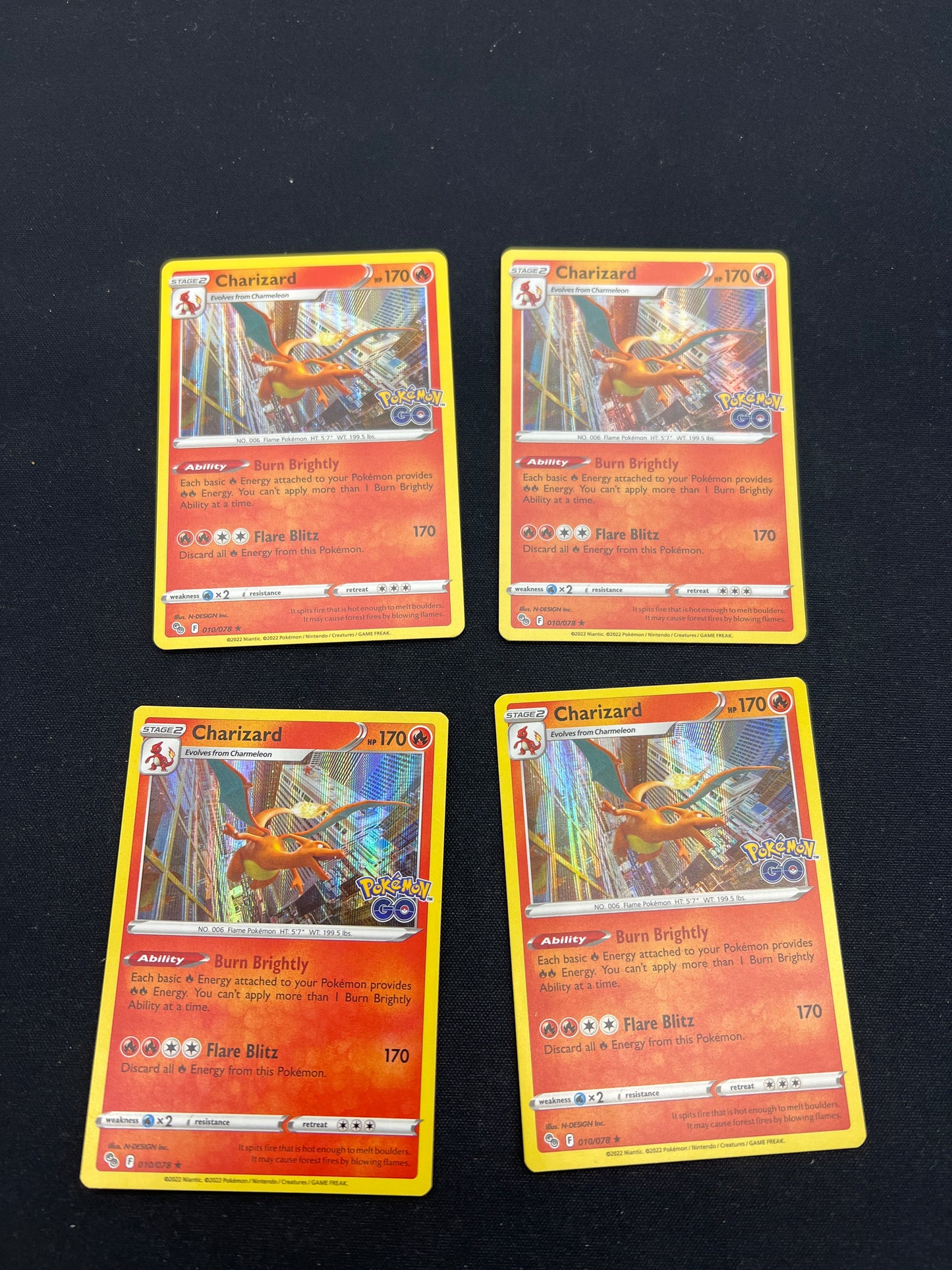 Auction Lot 359: Pokemon Cards Lot of 4 Charizard Holo Stamped Pokemon GO Conditions Vary