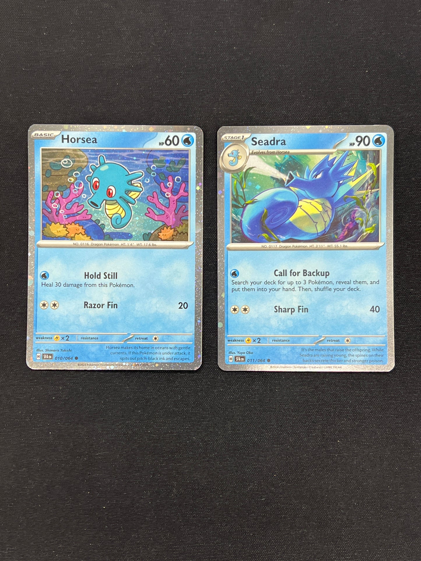Auction Lot 391: Pokemon Cards Lot of 2 Horsea & Seadra Cosmo Holo SV Promo Conditions Vary