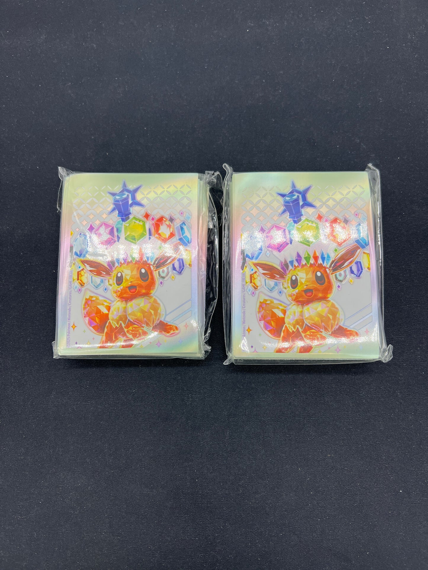 Auction Lot 312: Prismatic Evolutions ETB Card Sleeve Lot