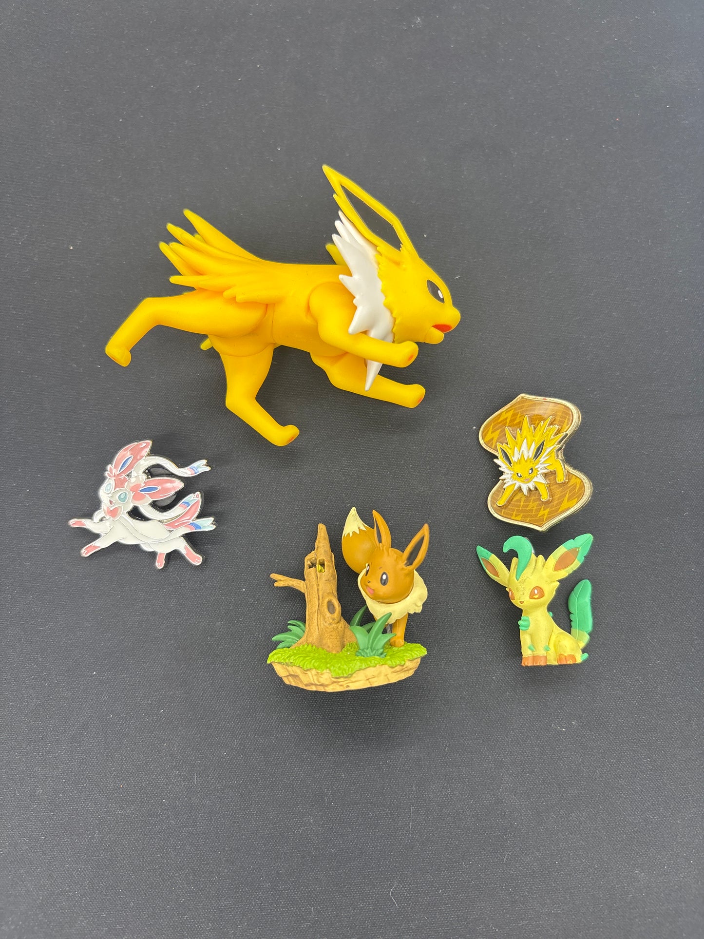 Auction Lot 76: Pokemon Eeveelution Pins and Figures Lot