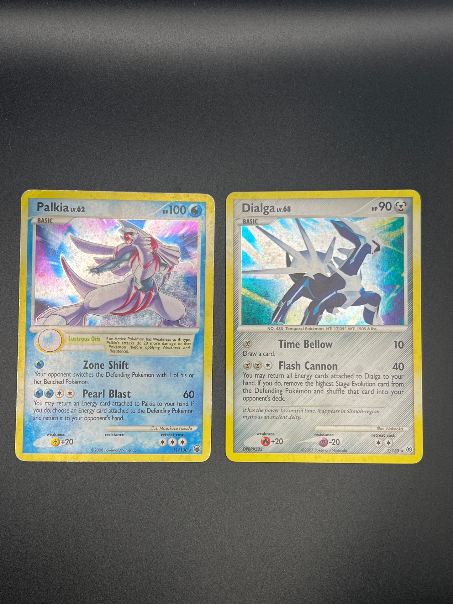 Auction Lot 303: Pokemon Cards Lot of 2 Palkia and Dialga Mid Era Holos Conditions Vary