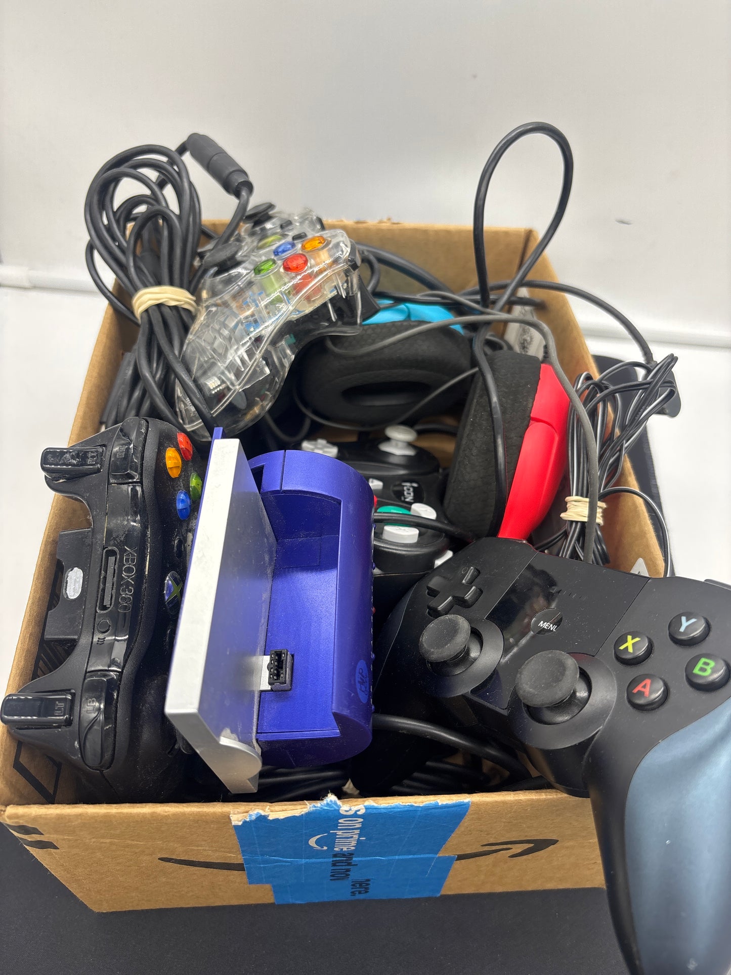Auction Lot 118: Assorted Controller and Cords for Gaming Consoles