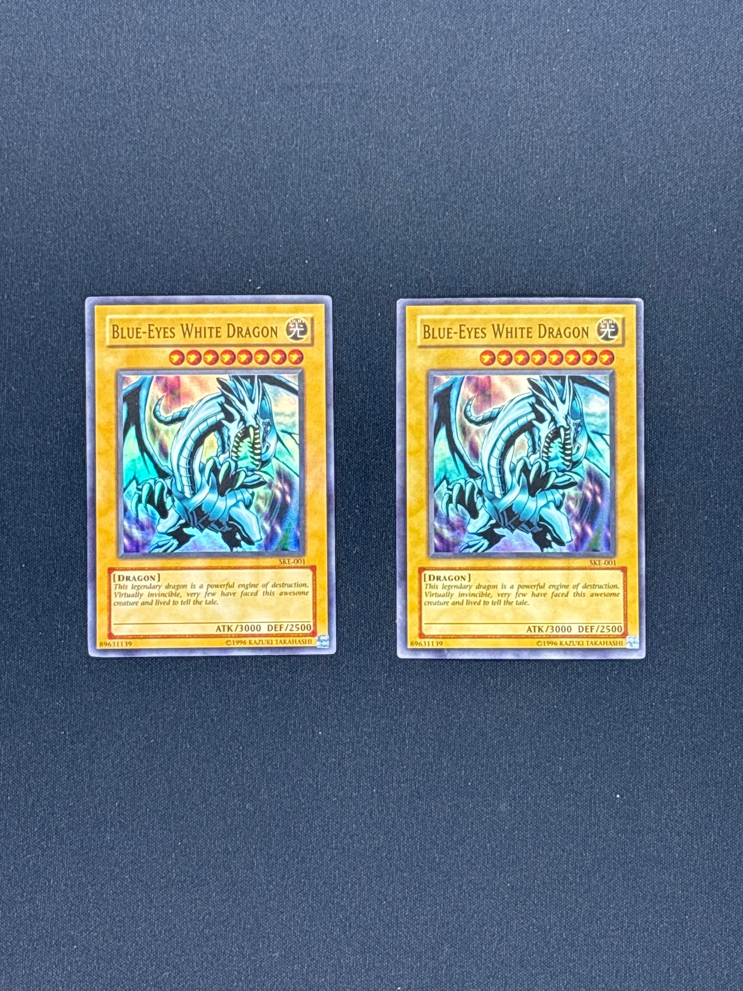 Auction Lot 60: Yugioh Vintage Card Lot 3 Blue Eyes White Dragon SDE-001 Conditions Vary