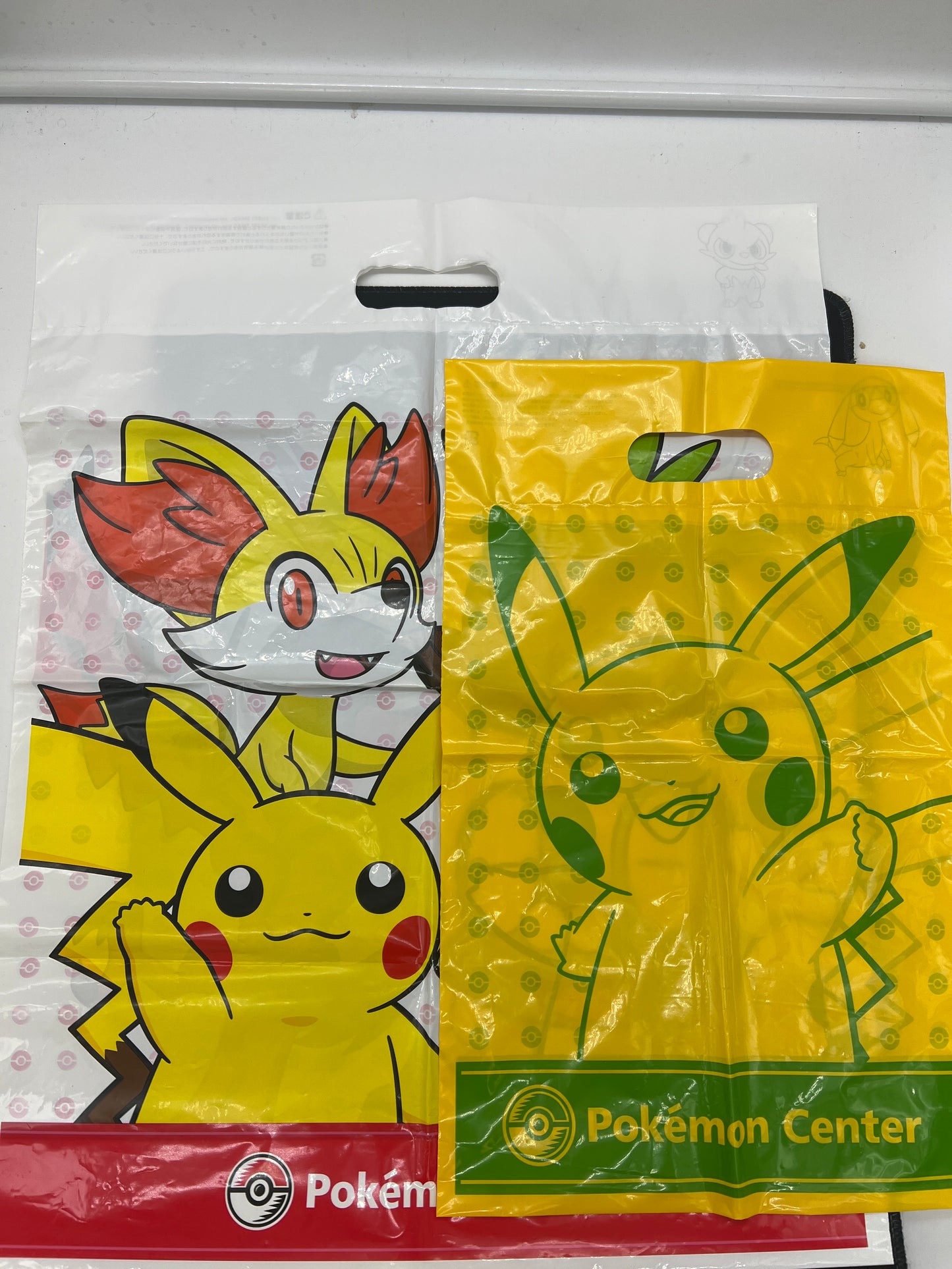 Auction Lot 303: Pokemon Center Shopping Bags EMPTY