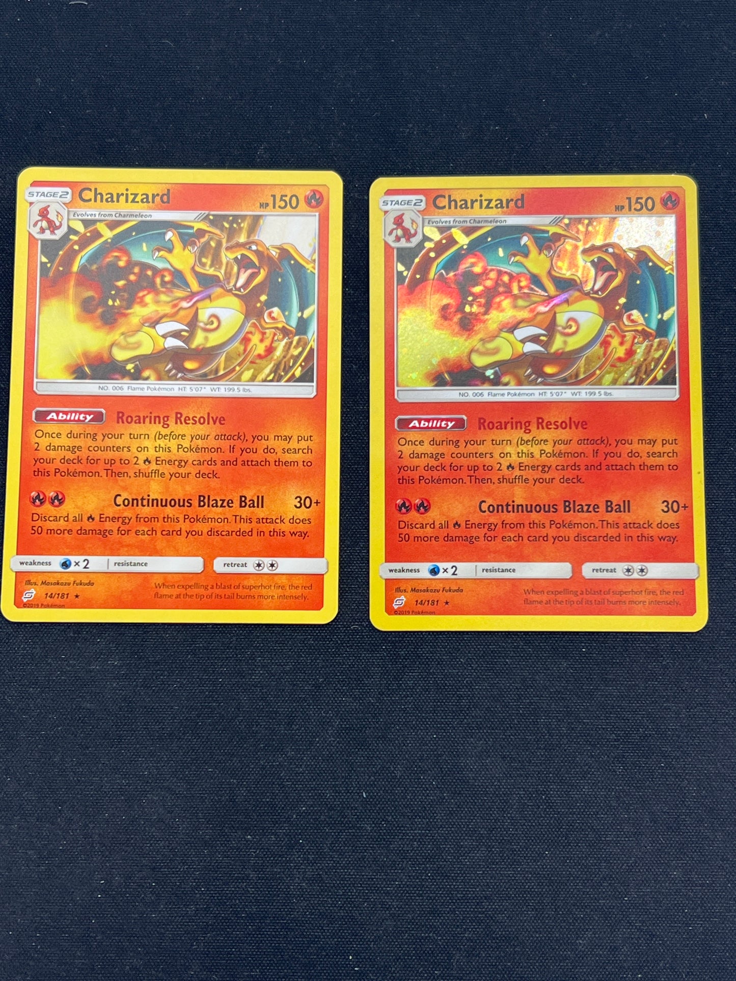 Auction Lot 390: Pokemon Cards Team Up Lot of 2 Non Holo Rare and Cosmo Holo Charizard 14/181 Conditions Vary