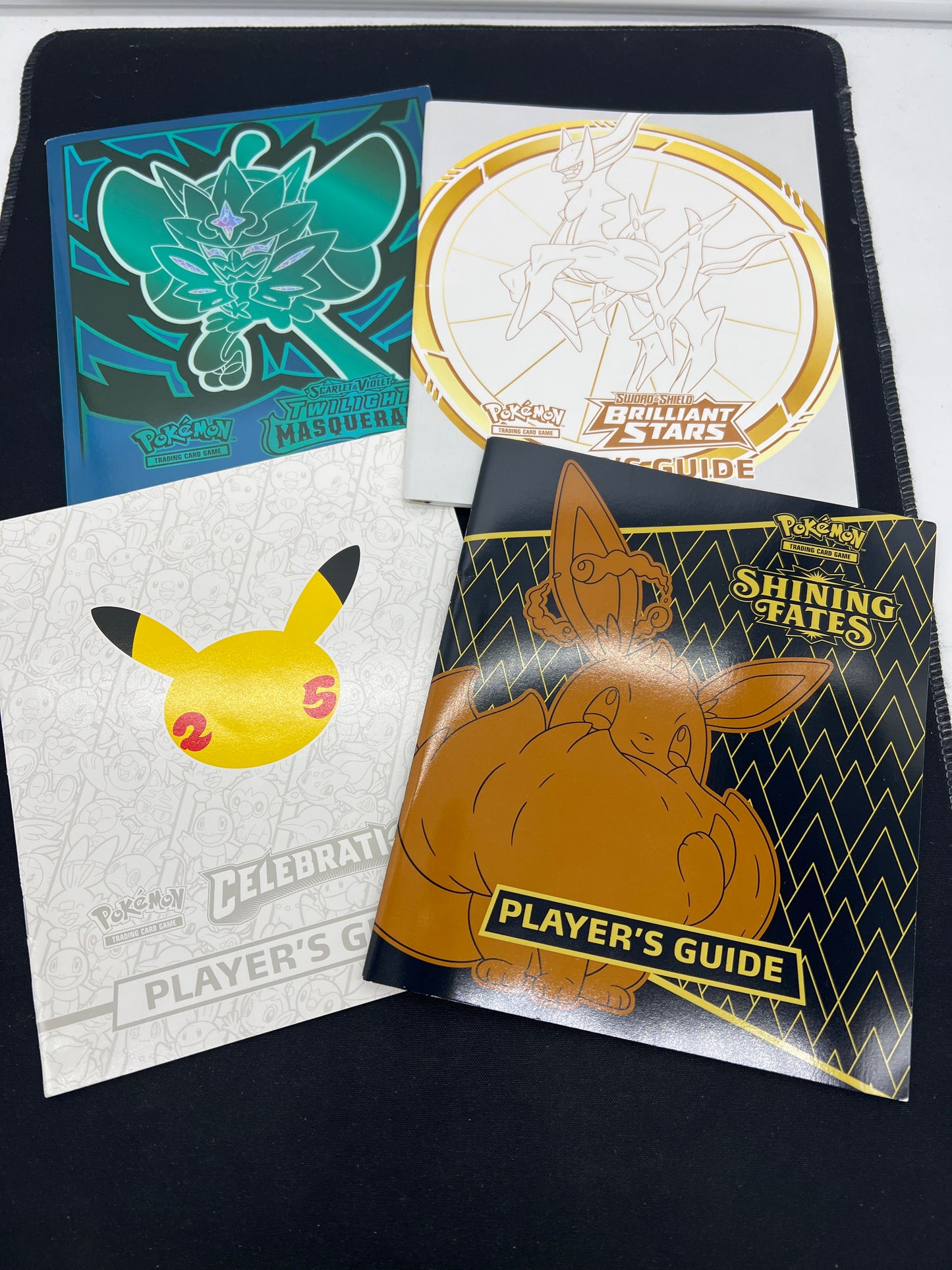 Auction Lot 11: Assorted Pokemon ETB Player Guides
