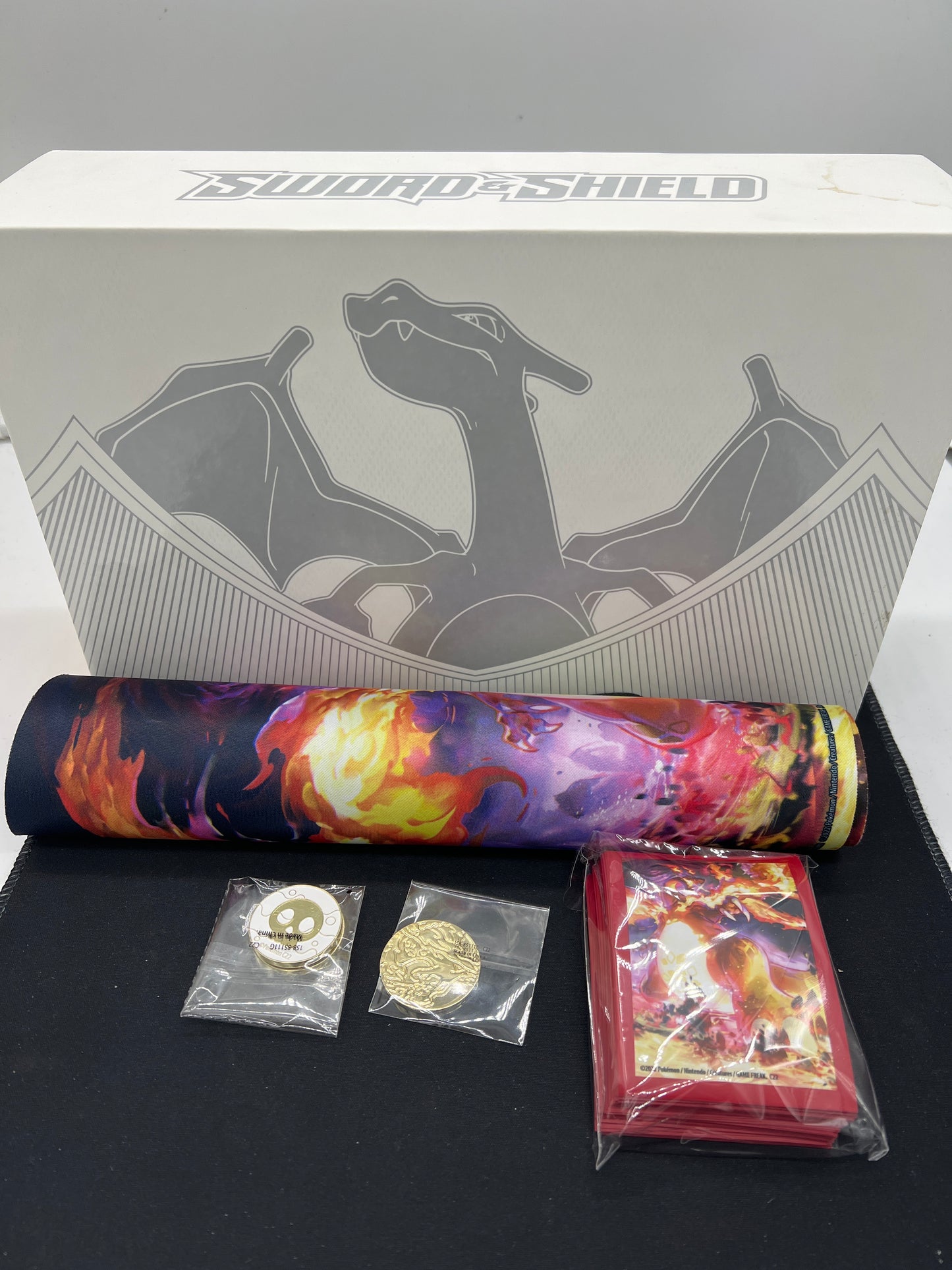 Auction Lot 283: Pokémon SWSH Charizard Empty UPC With Accesories and Playmat