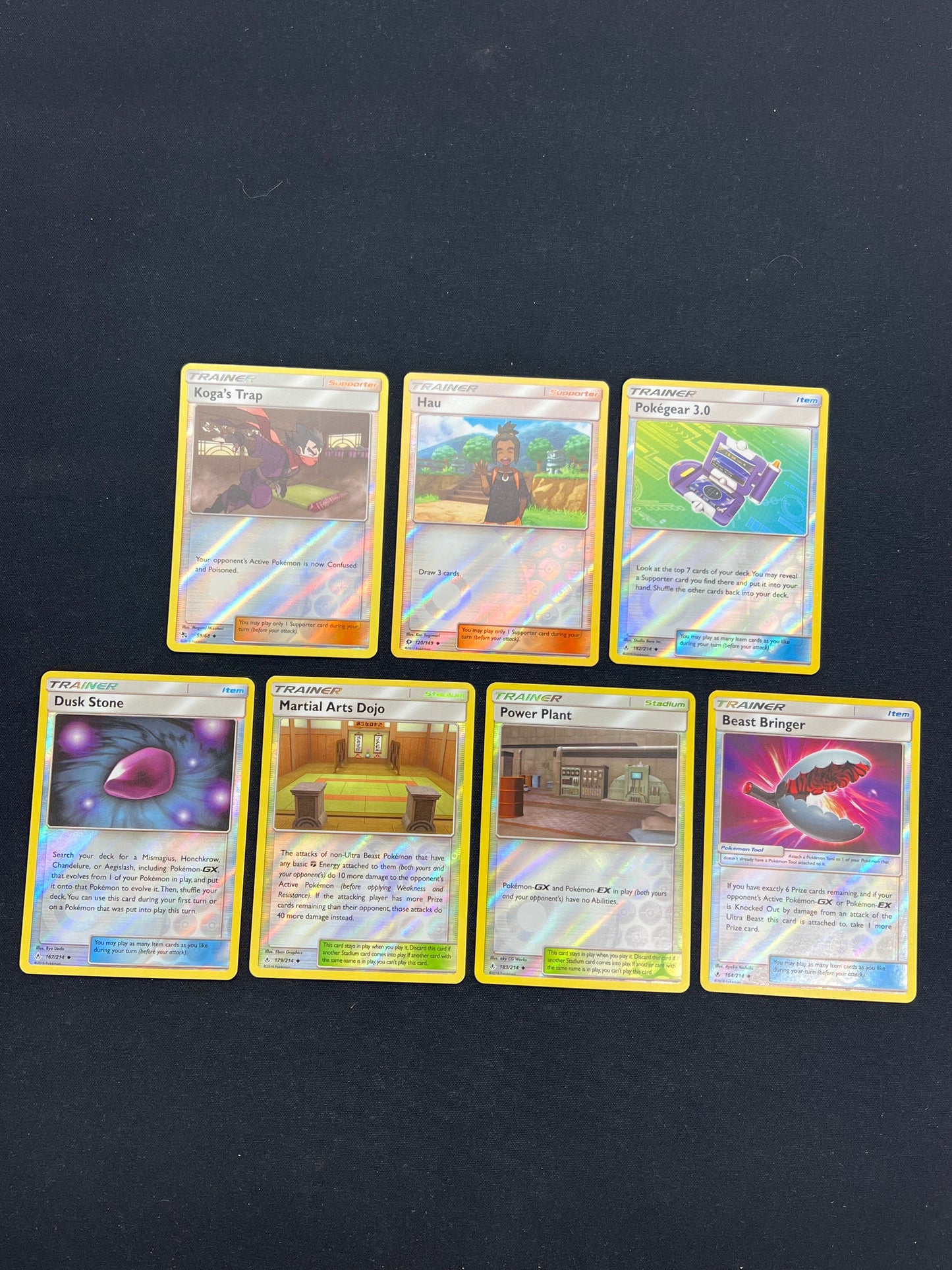 Auction Lot 52: Pokemon Cards Lot of 7 SM Era Holo Trainers Lot Condition Vary