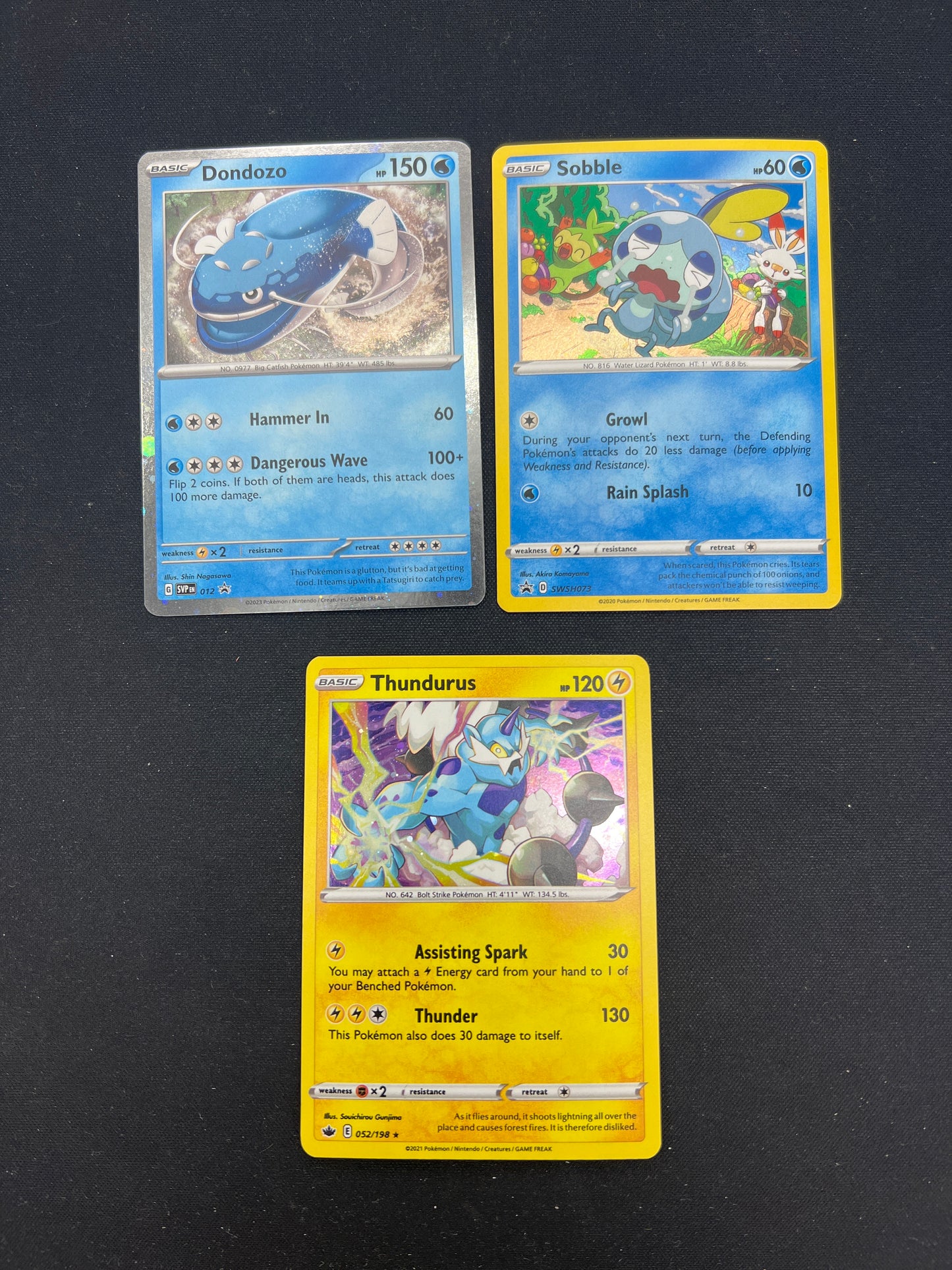 Auction Lot 104: Pokemon Cards Lot of 3 Assorted Cosmo Holos Conditions Vary