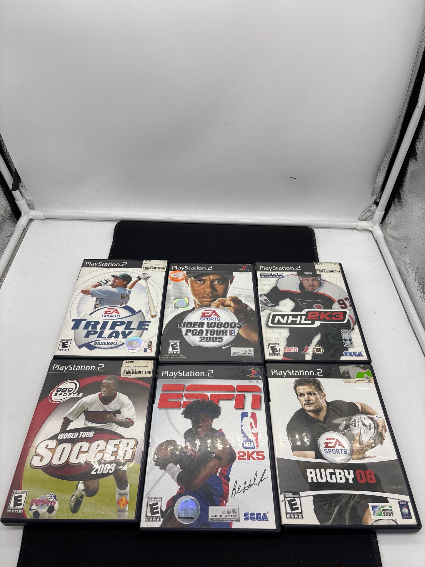 Auction Lot 114: Playstation 2 Video Game Lot of 6 Triple Play Baseball World Tour Soccer 2003 Tiger Woods PGA Tour 2005 ESPN NBA 2K5 NHL 2K3 Rugby 08