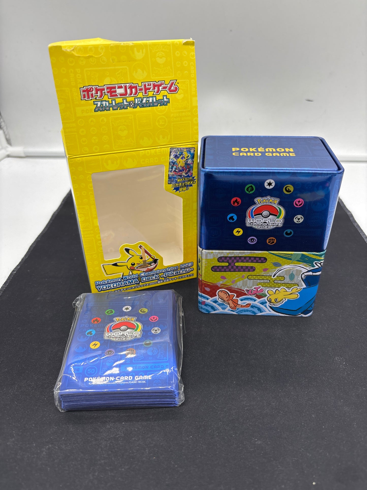 Auction Lot 48: Pokemon World Championship EMPTY Tin and Sleeves